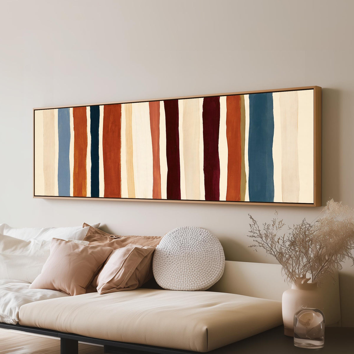 Rust, navy and maroon stripes panoramic canvas print above a sofa in a living room