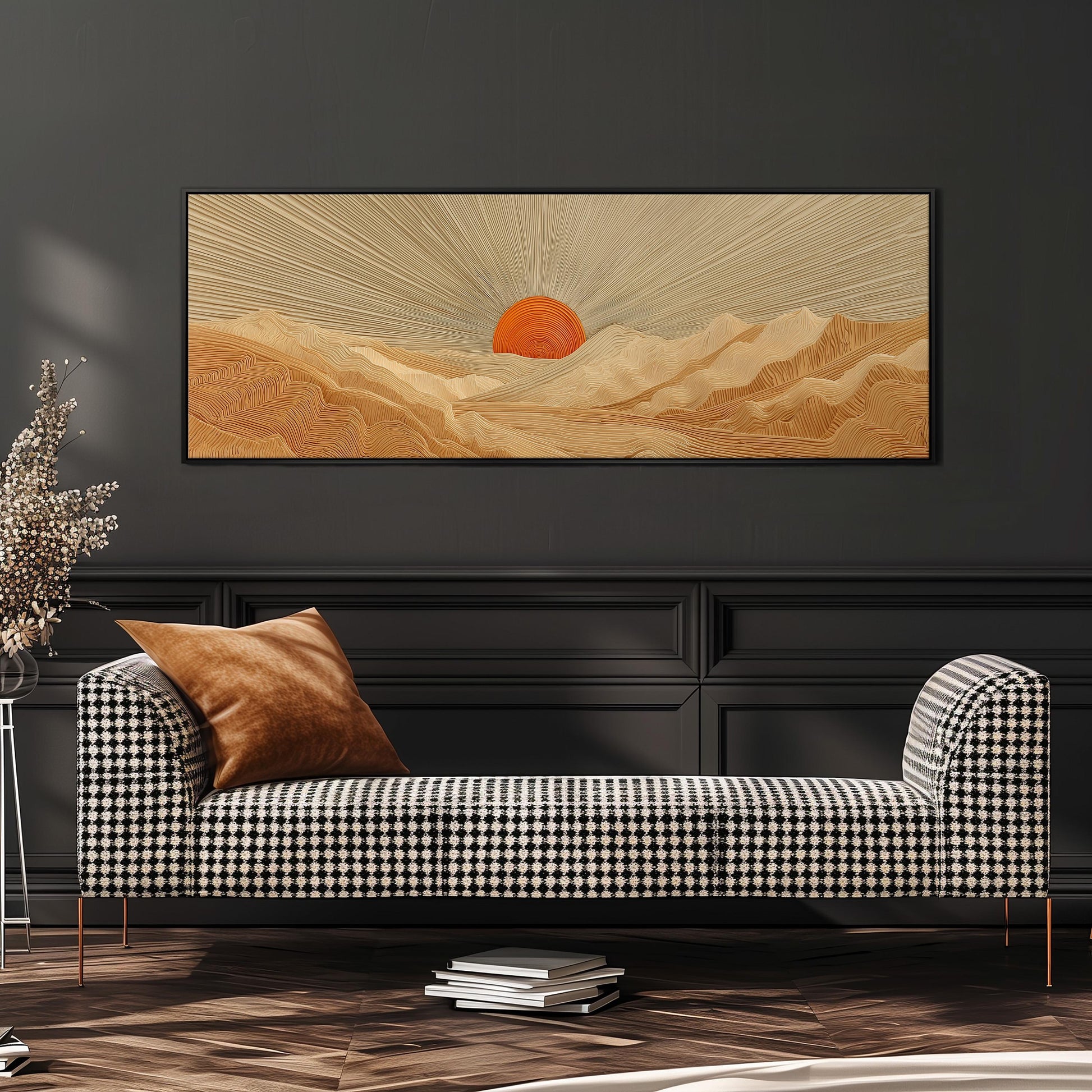a large, rectangular painting of a desert landscape with a sun in the background, hanging on a wall above a black and white checkered sofa.