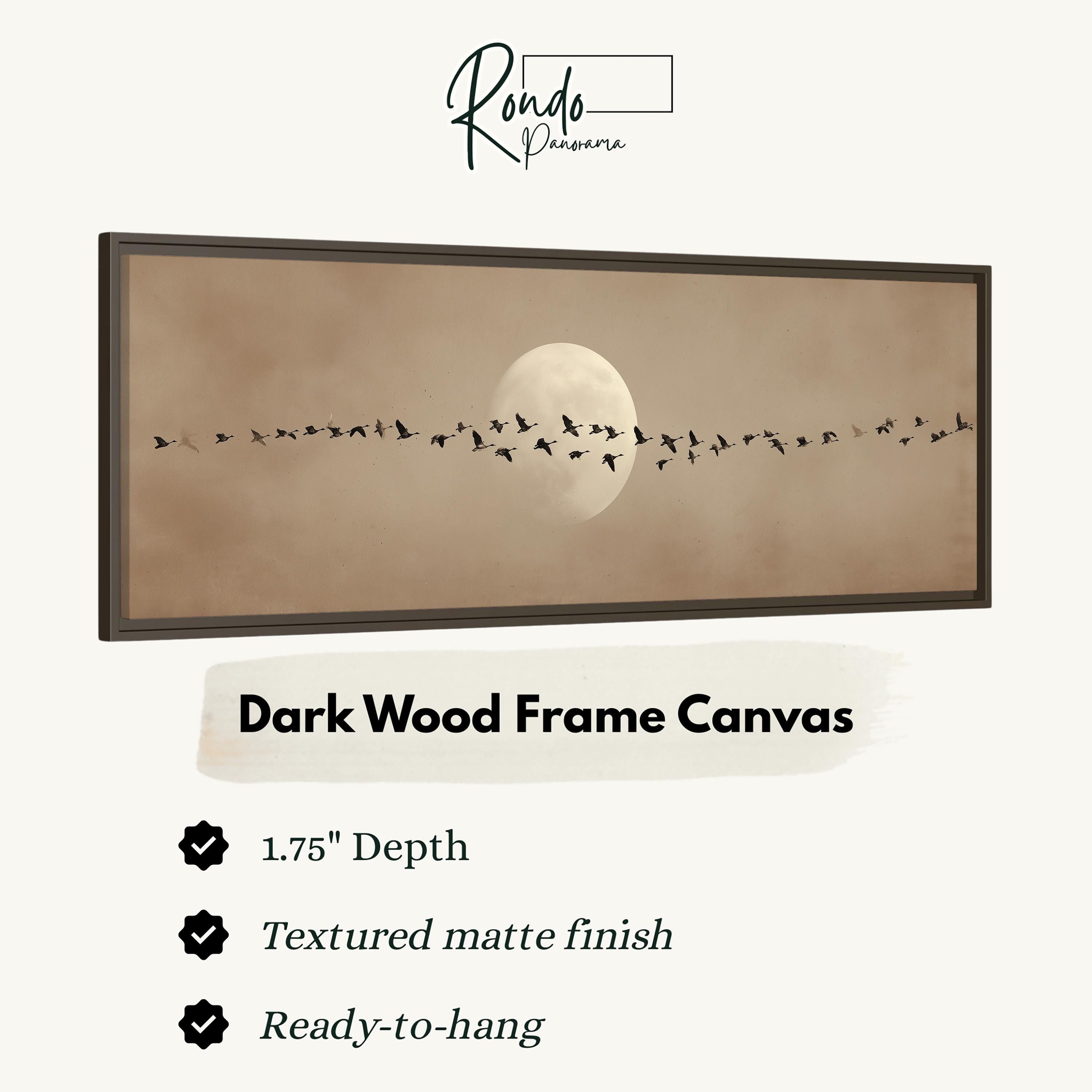 a dark wood frame canvas with a large full moon and a flock of birds flying across the sky.