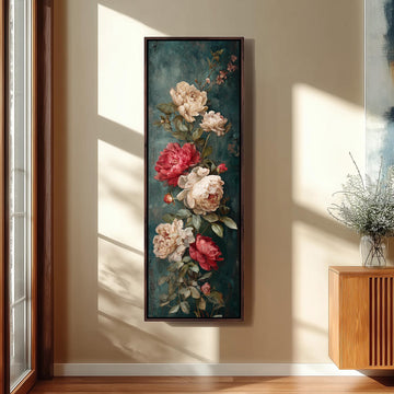 a large framed painting of a floral arrangement hanging on a wall.