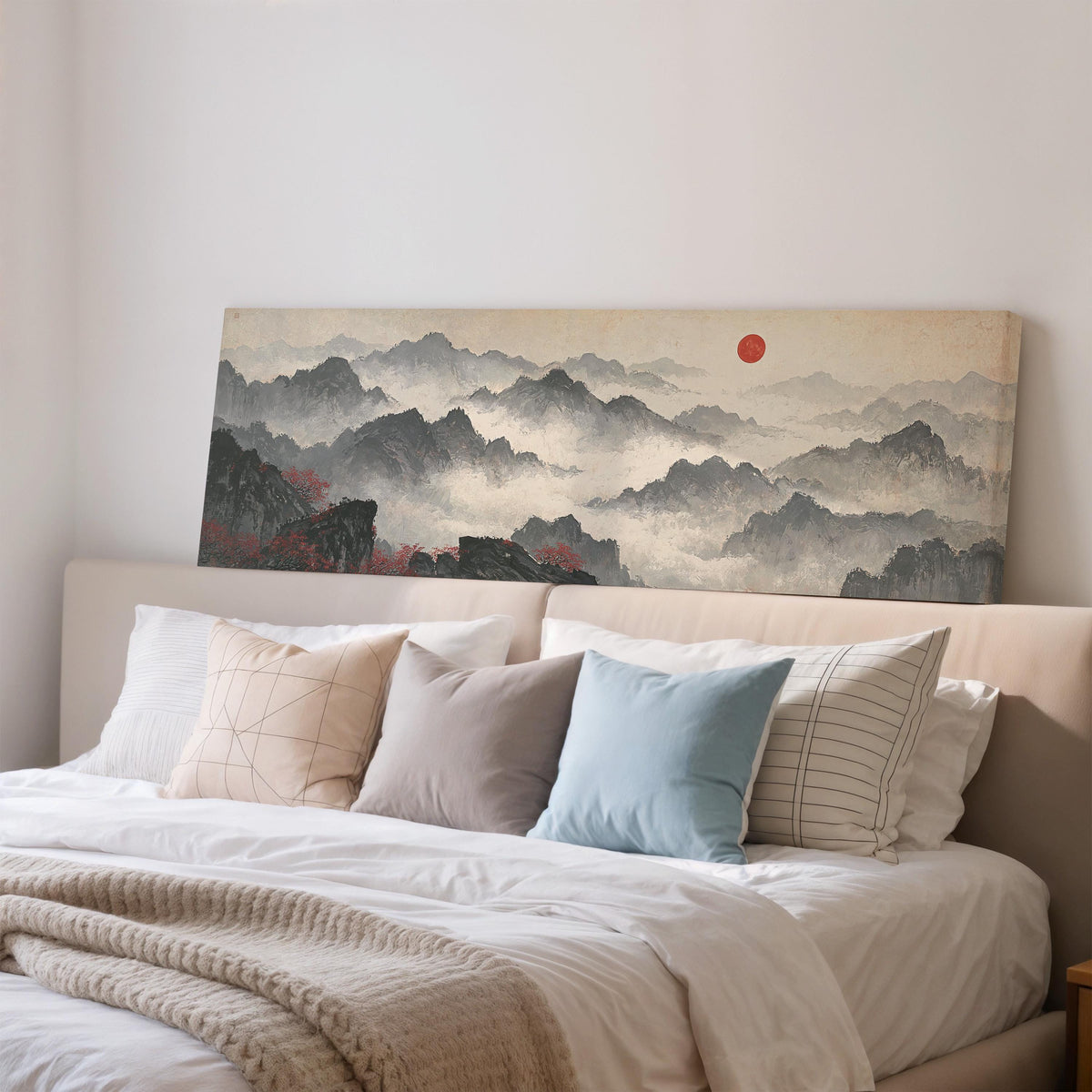 Misty ink mountains under a red sun wide panoramic canvas print above a bed in a bedroom