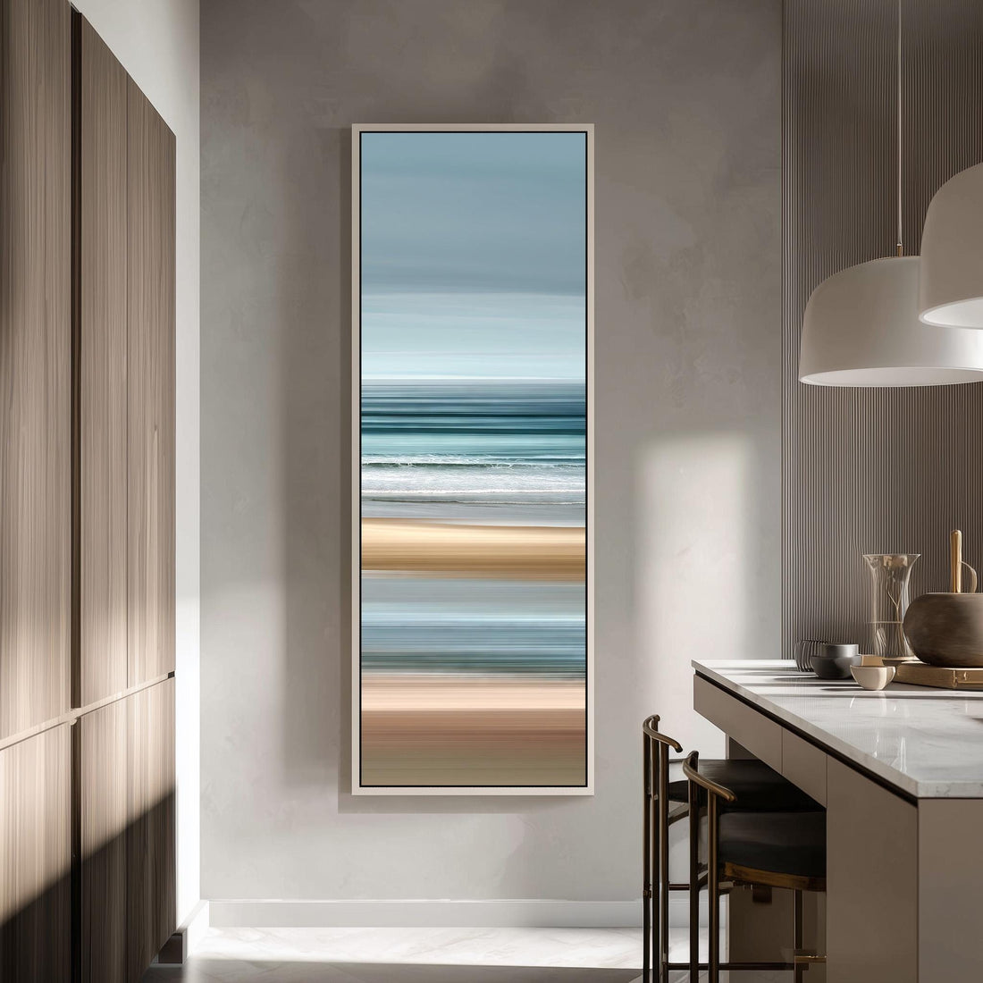 a modern kitchen with a large framed painting of a beach scene hanging on the wall.