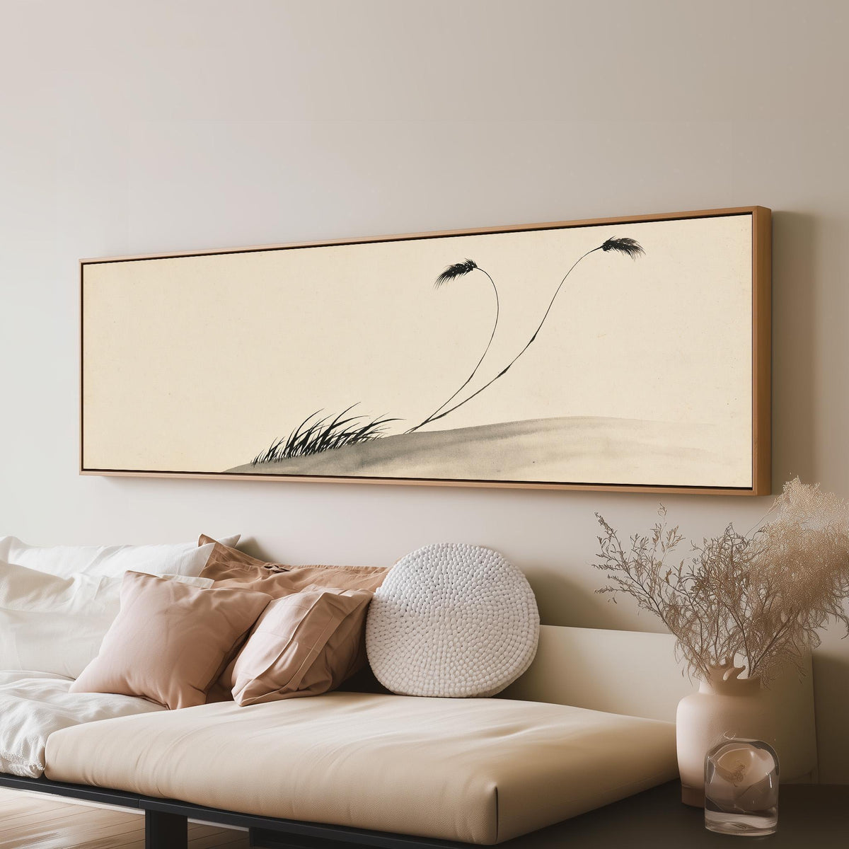 Two birds perched on bending ink reeds long horizontal canvas print above a sofa in a living room