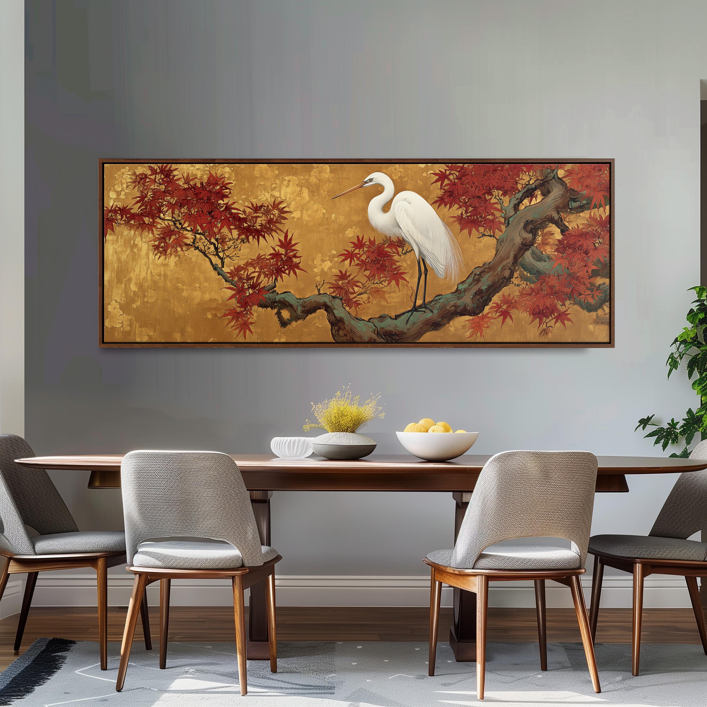 a dining room with a large painting of a white crane perched on a branch with red leaves above a wooden table. The table is set with a bowl of fruit and a vase of flowers. The room has gray walls and a gray carpet, creating a modern and minimalist aesthetic.