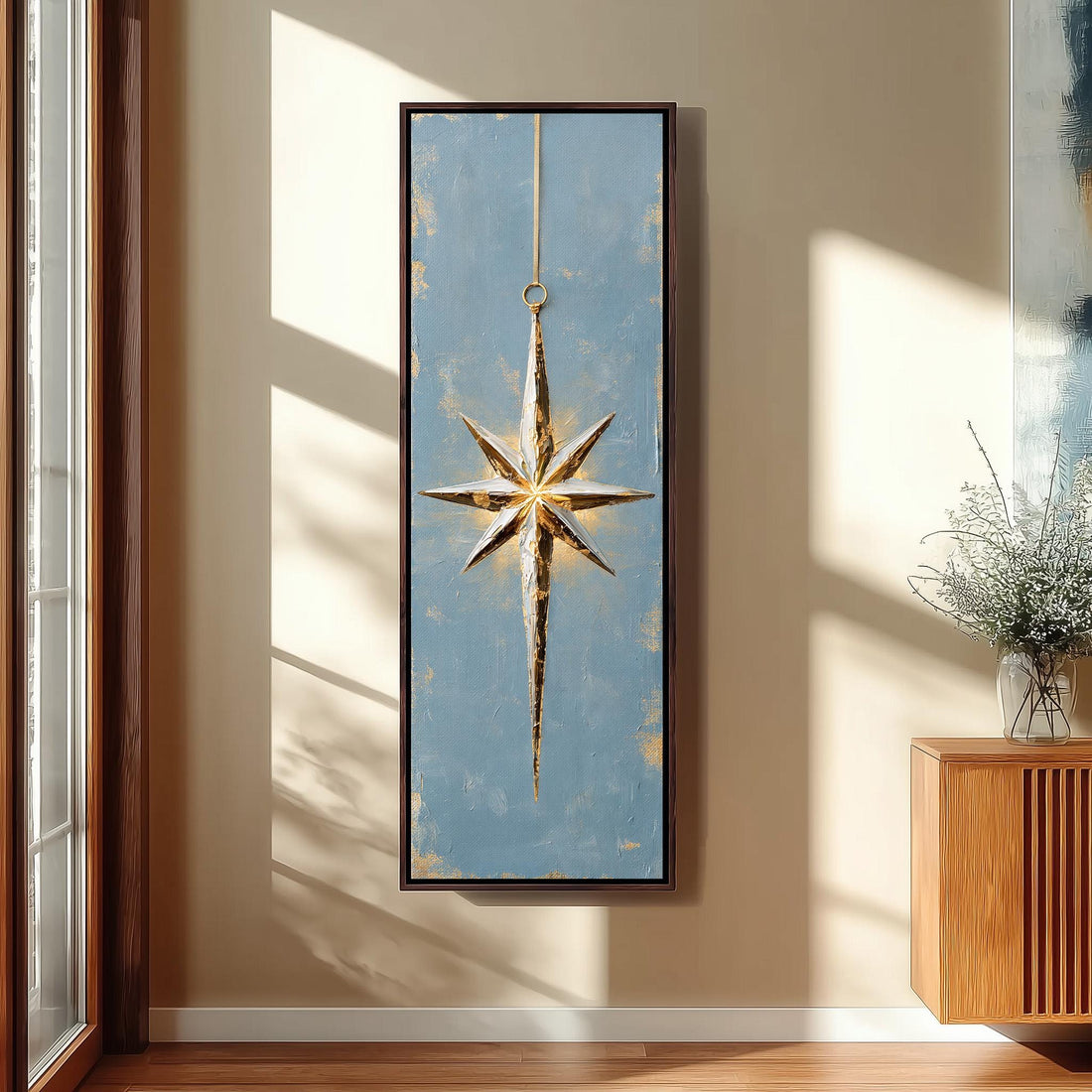 Gold and silver star ornament on blue long vertical canvas print in a sunlit living space