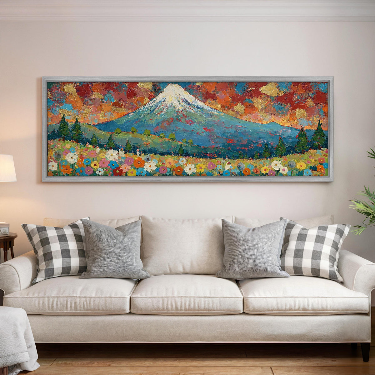 Mount Fuji above autumn trees and wildflowers panoramic canvas print above a white sofa in a bright living room