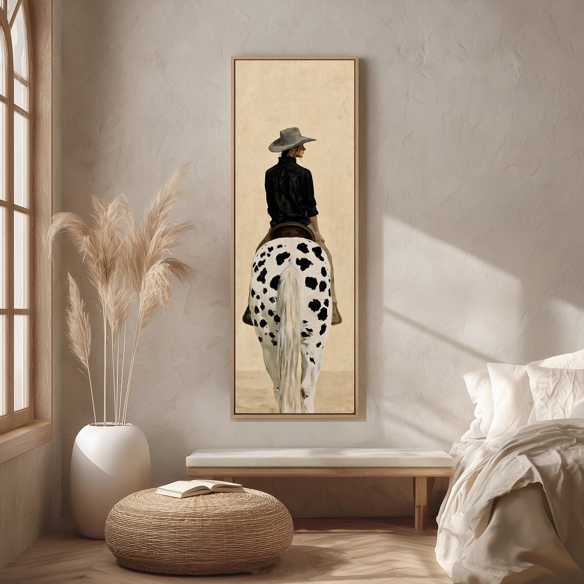 Cowgirl with a long braid on a spotted horse long vertical canvas print in a bright reading corner