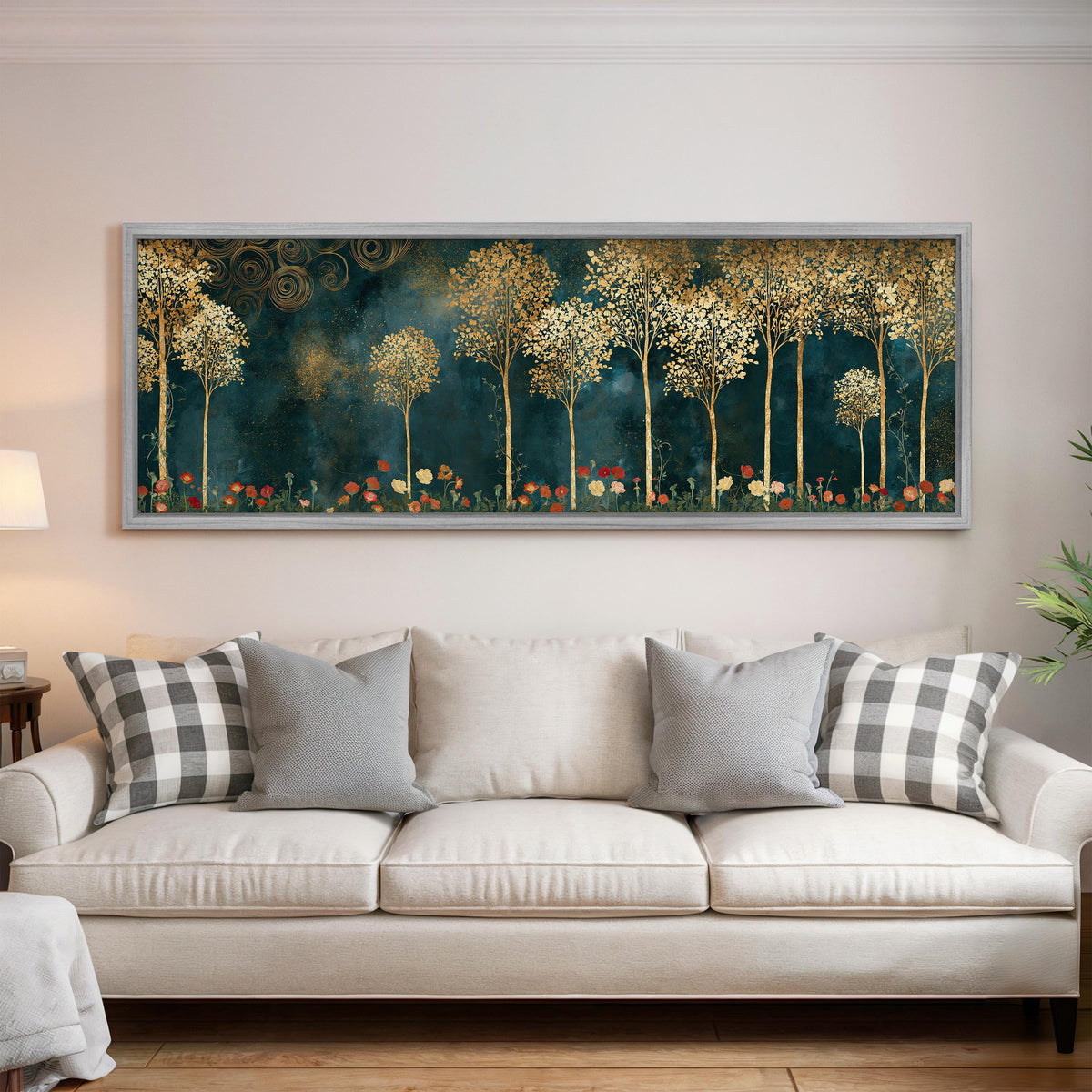 Gold leaf trees above red poppies on teal panoramic canvas print above a white sofa in a bright living room
