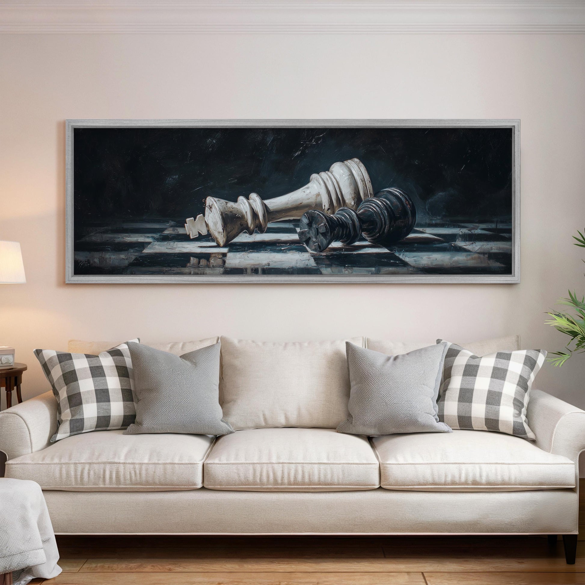 a large painting of a chess king and pieces hanging on a wall above a white sofa with gray and white plaid throw pillows.