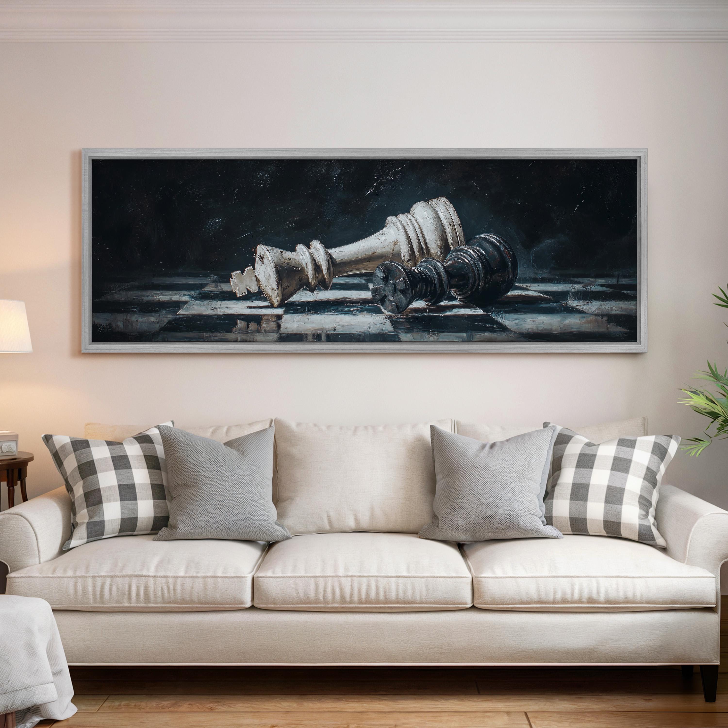 a large painting of a chess king and pieces hanging on a wall above a white sofa with gray and white plaid throw pillows.
