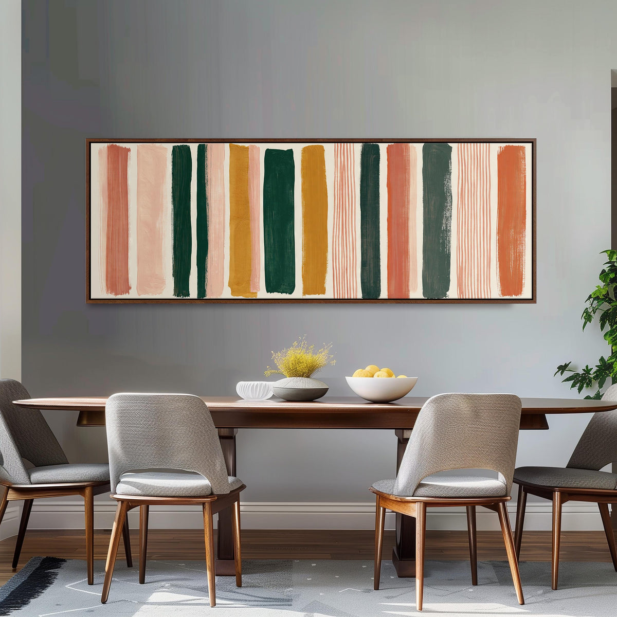 Mixed stripe blocks in terracotta, pink and green long horizontal canvas print above a sofa in a living room