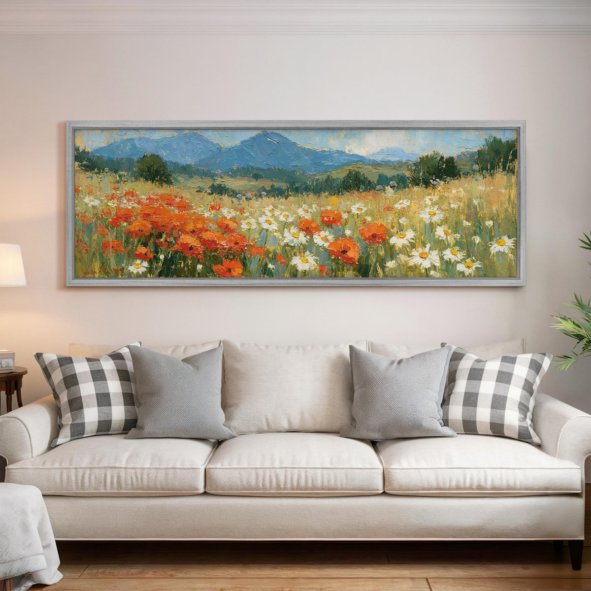 Alpine poppy and daisy meadow panoramic canvas print above a white sofa in a bright living room