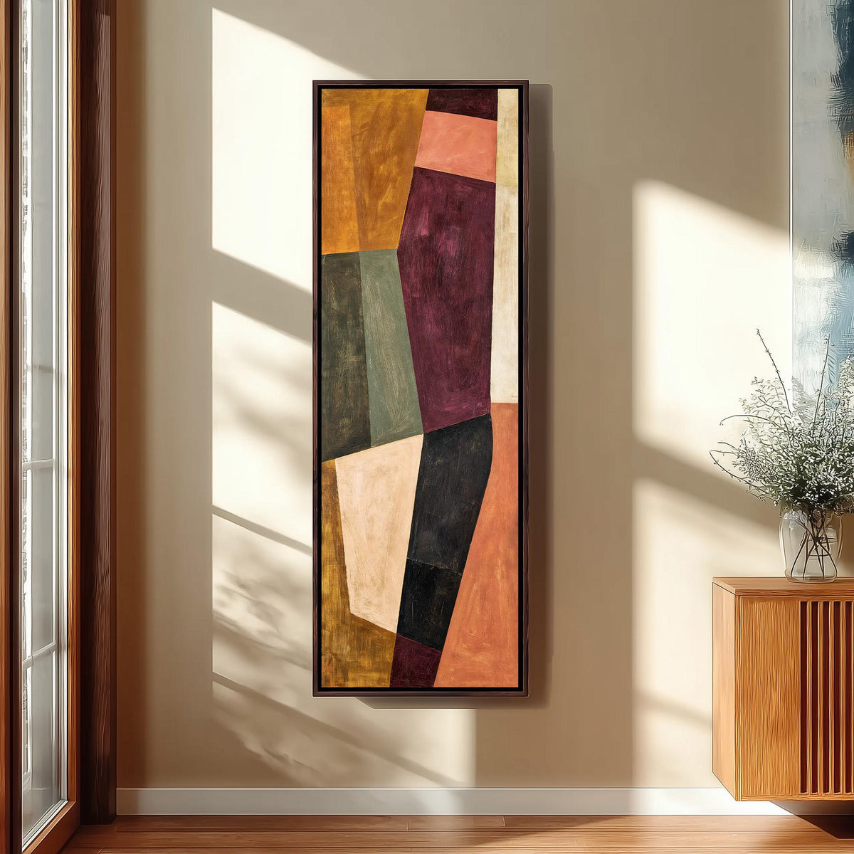 Angular blocks in mustard, maroon and blush tall narrow canvas print beside a staircase in an entryway