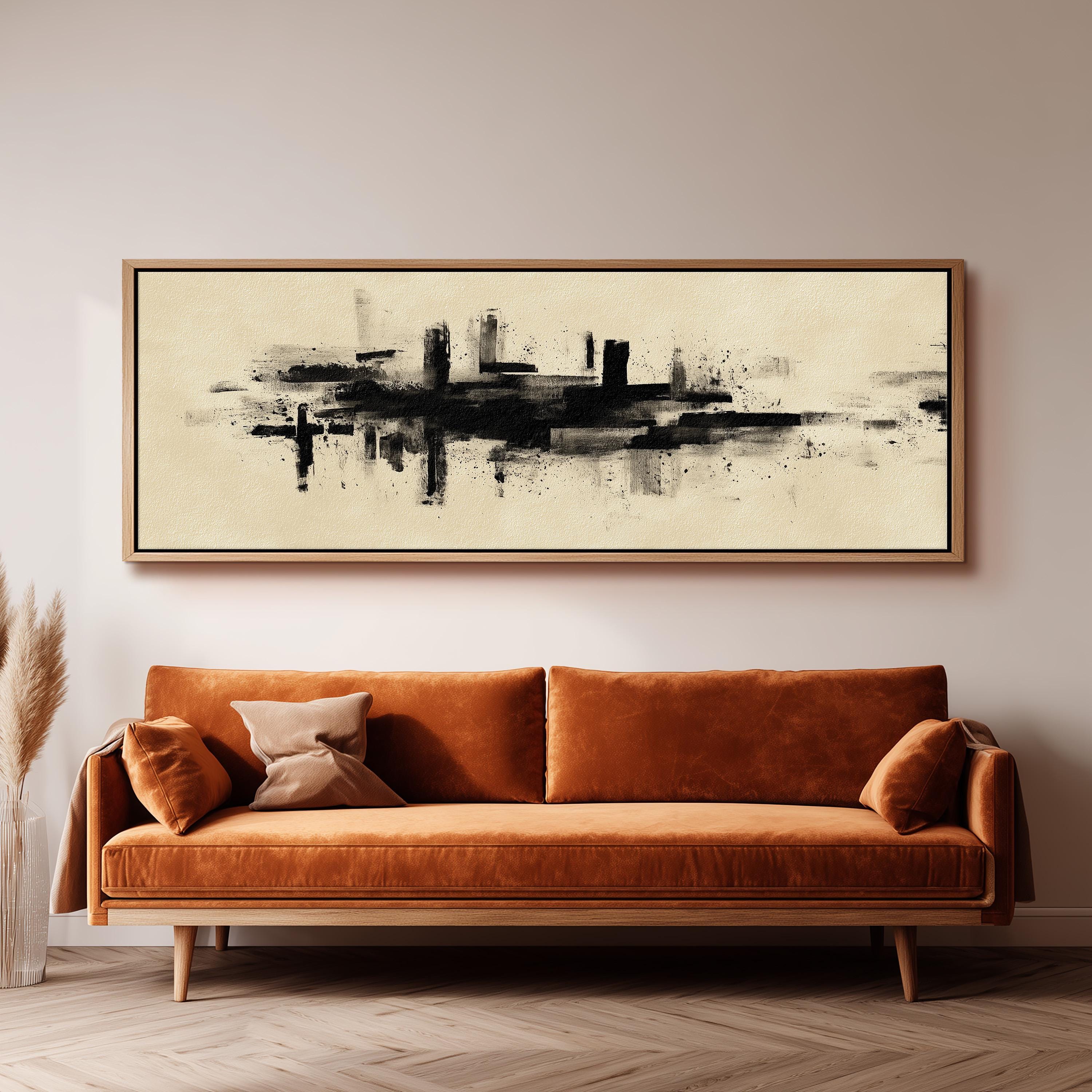 a large abstract painting hanging on a wall above a brown sofa with orange cushions.