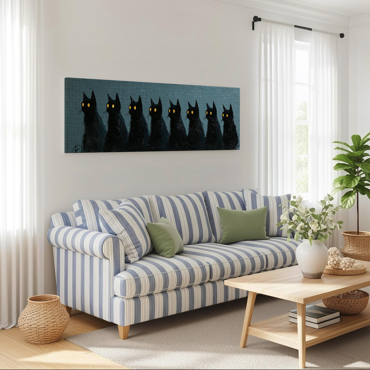 Row of black cats with glowing eyes long horizontal canvas print above a striped sofa in a coastal living room
