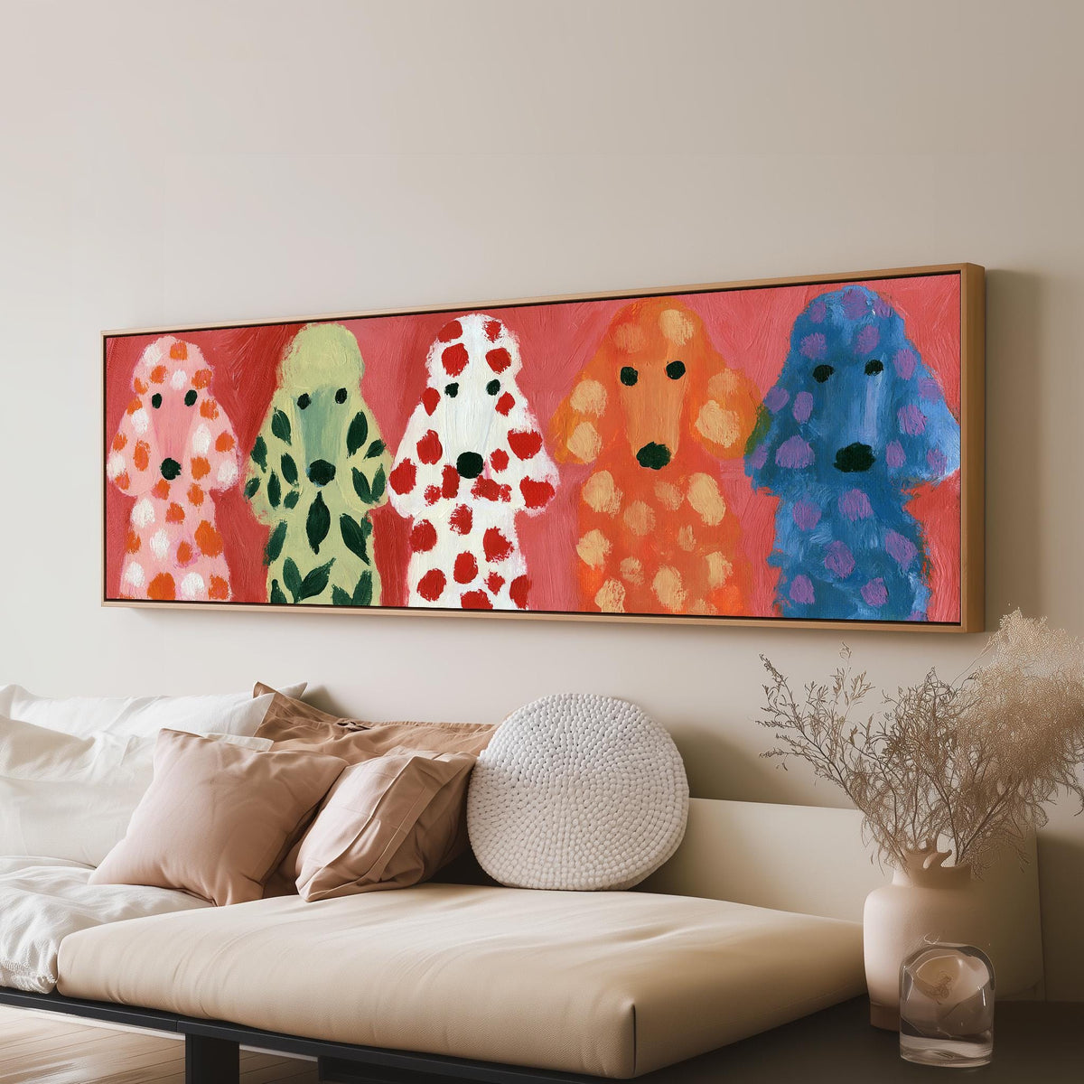 Five colorful poodles panoramic canvas print above a sofa in a living room