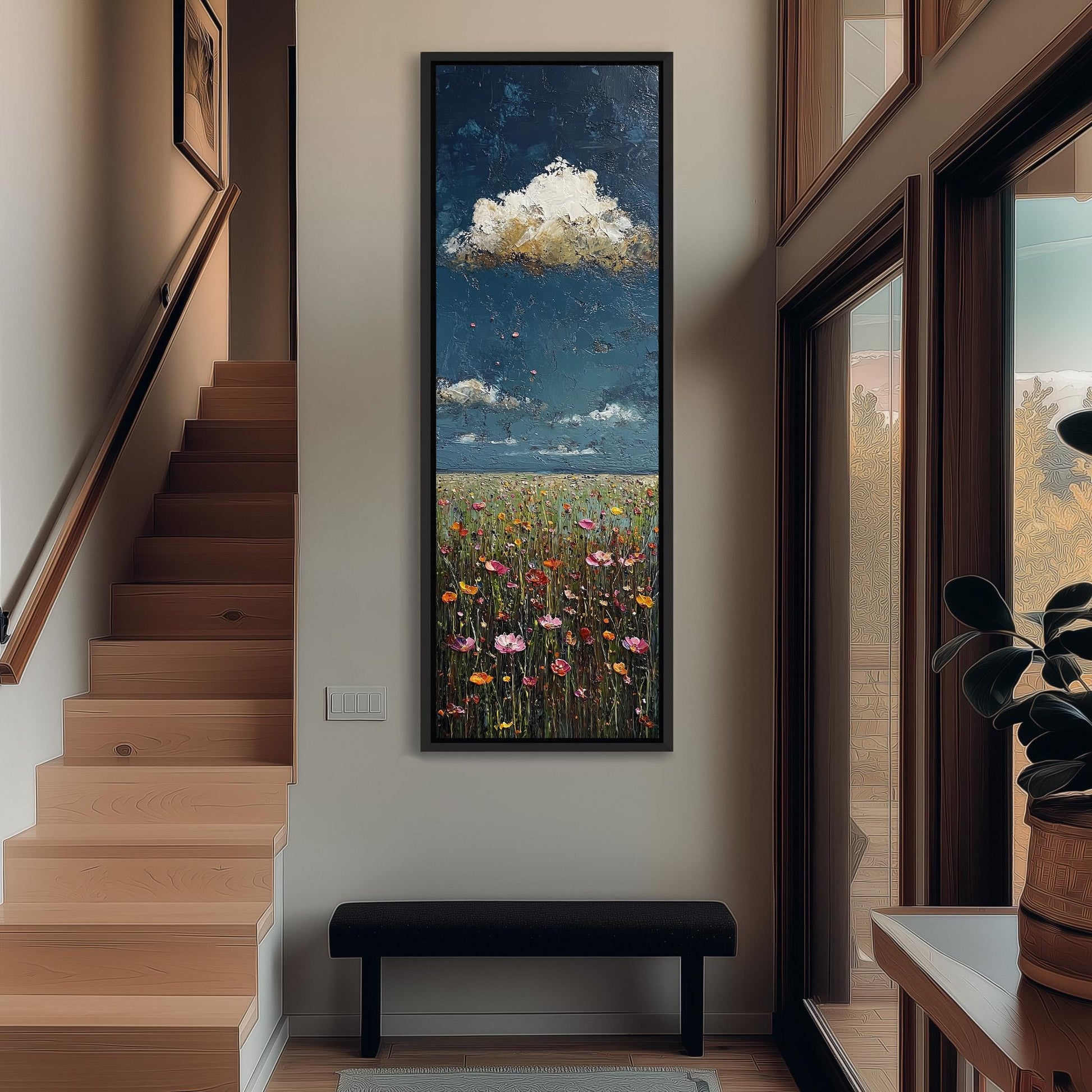 a large painting of a field with flowers hanging on the wall of a hallway. The painting is framed and appears to be the focal point of the space.