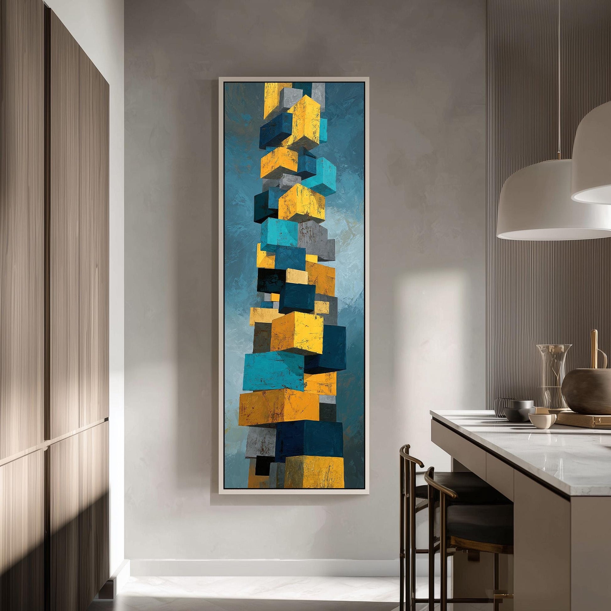 a modern kitchen with a large abstract painting hanging on the wall. The painting consists of a series of stacked cubes in various colors, including yellow, blue, and gray. The kitchen is equipped with a white countertop and a dining table with chairs.