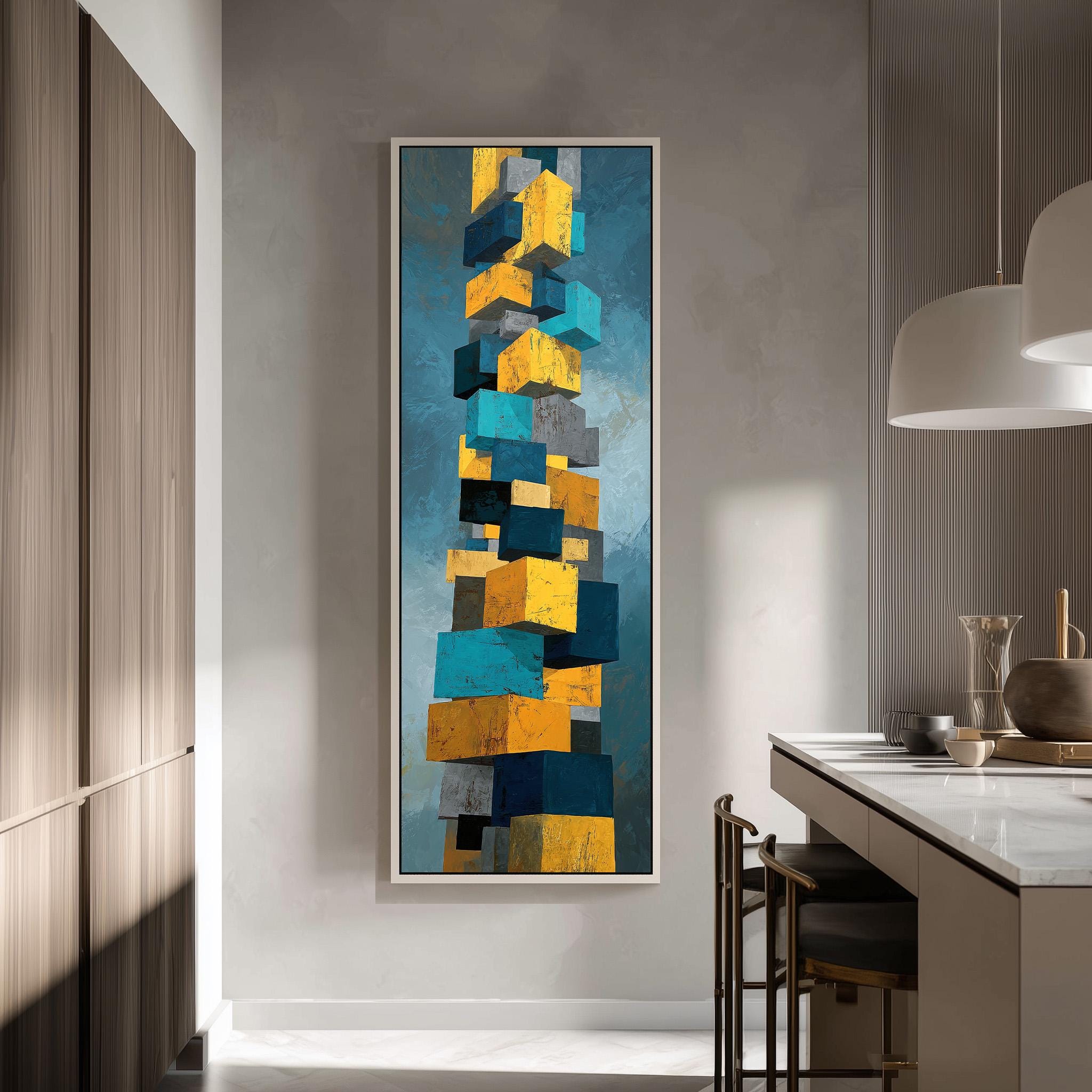 a modern kitchen with a large abstract painting hanging on the wall. The painting consists of a series of stacked cubes in various colors, including yellow, blue, and gray. The kitchen is equipped with a white countertop and a dining table with chairs.