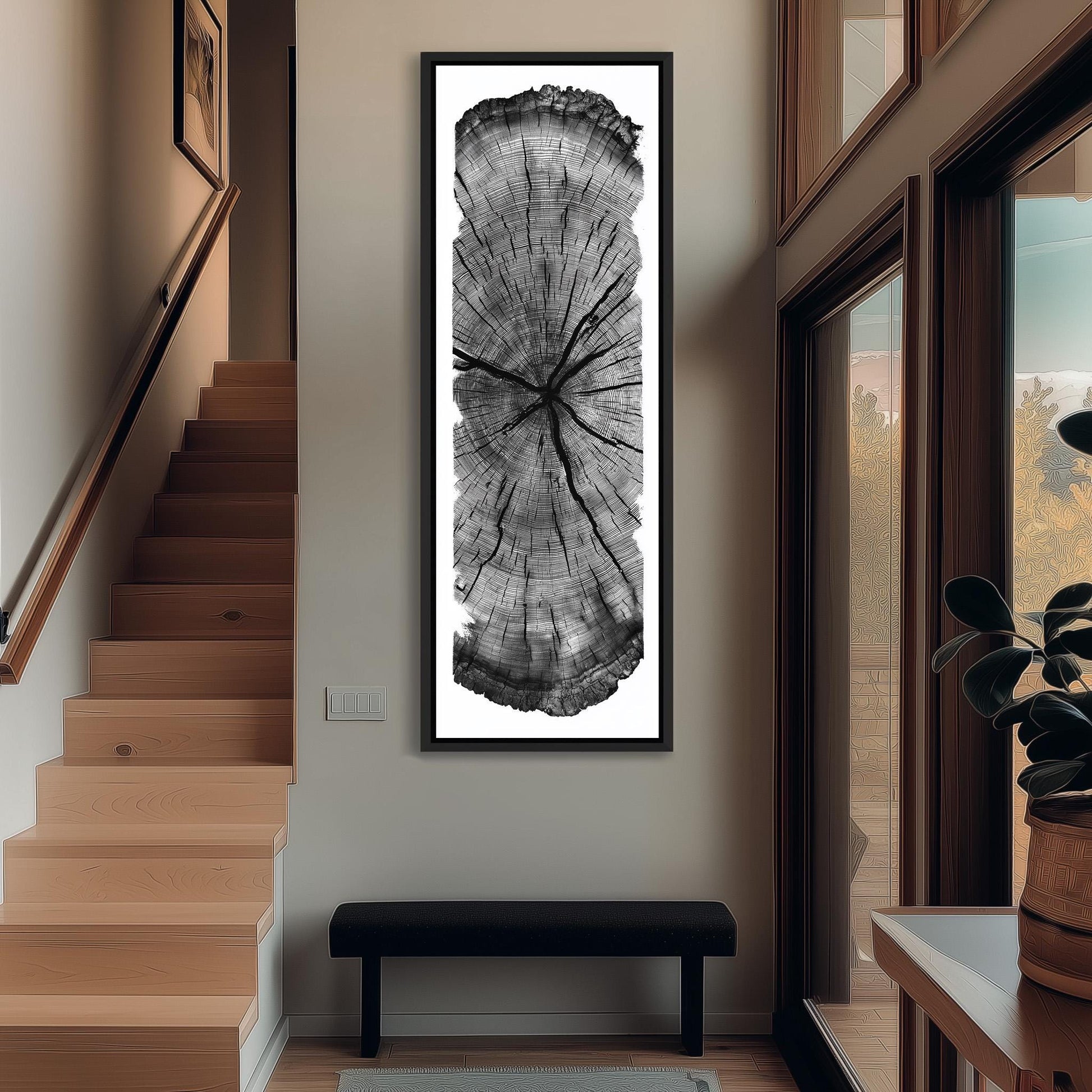 a large black and white tree trunk photograph displayed on the wall of a hallway.