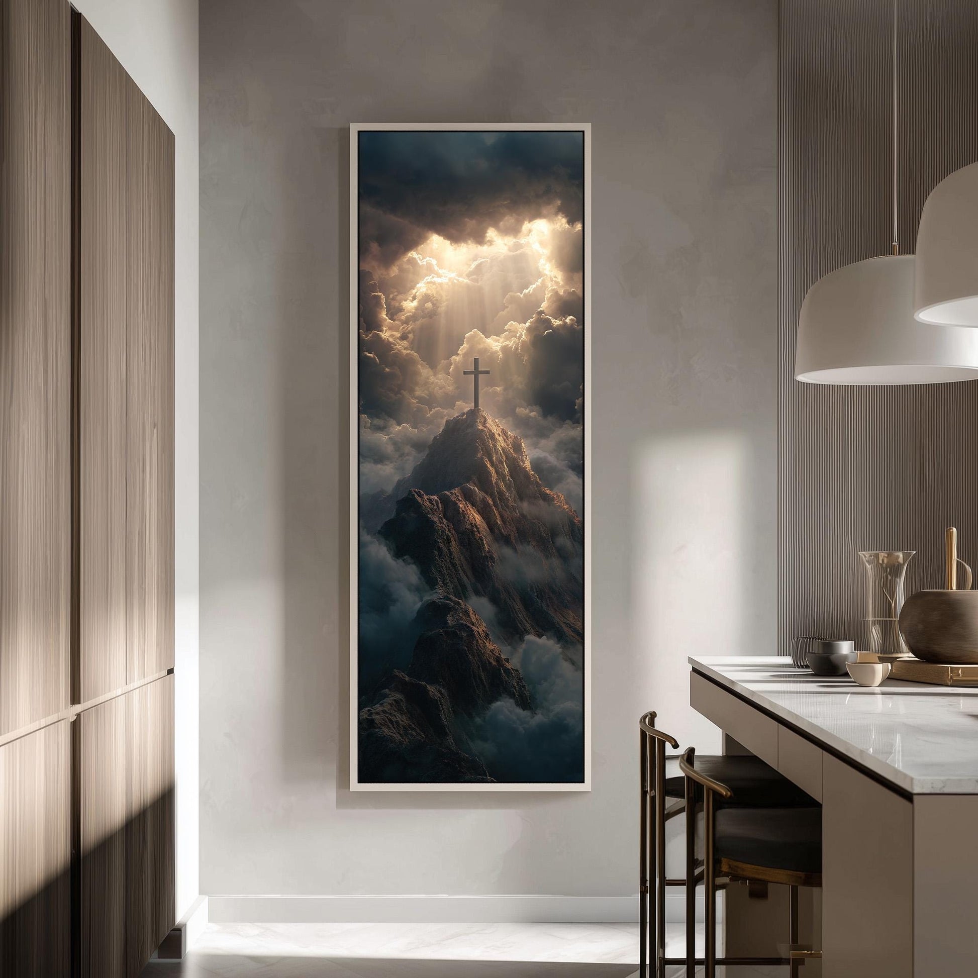 a large framed painting of a mountain with a cross on top, set against a dramatic sky with clouds and sunlight.