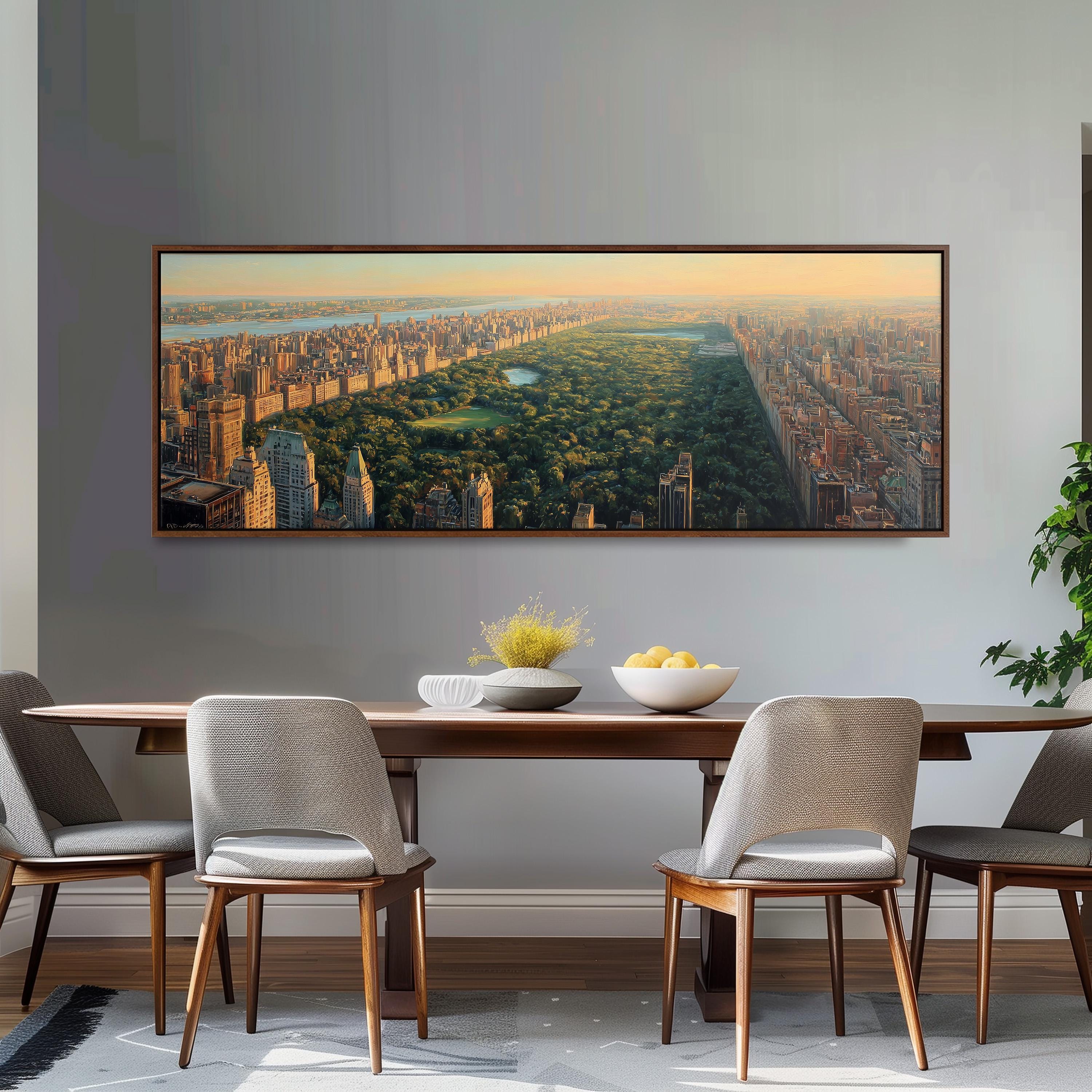 a large, framed painting of a cityscape with a park in the foreground, hanging on a wall above a wooden dining table with four chairs.