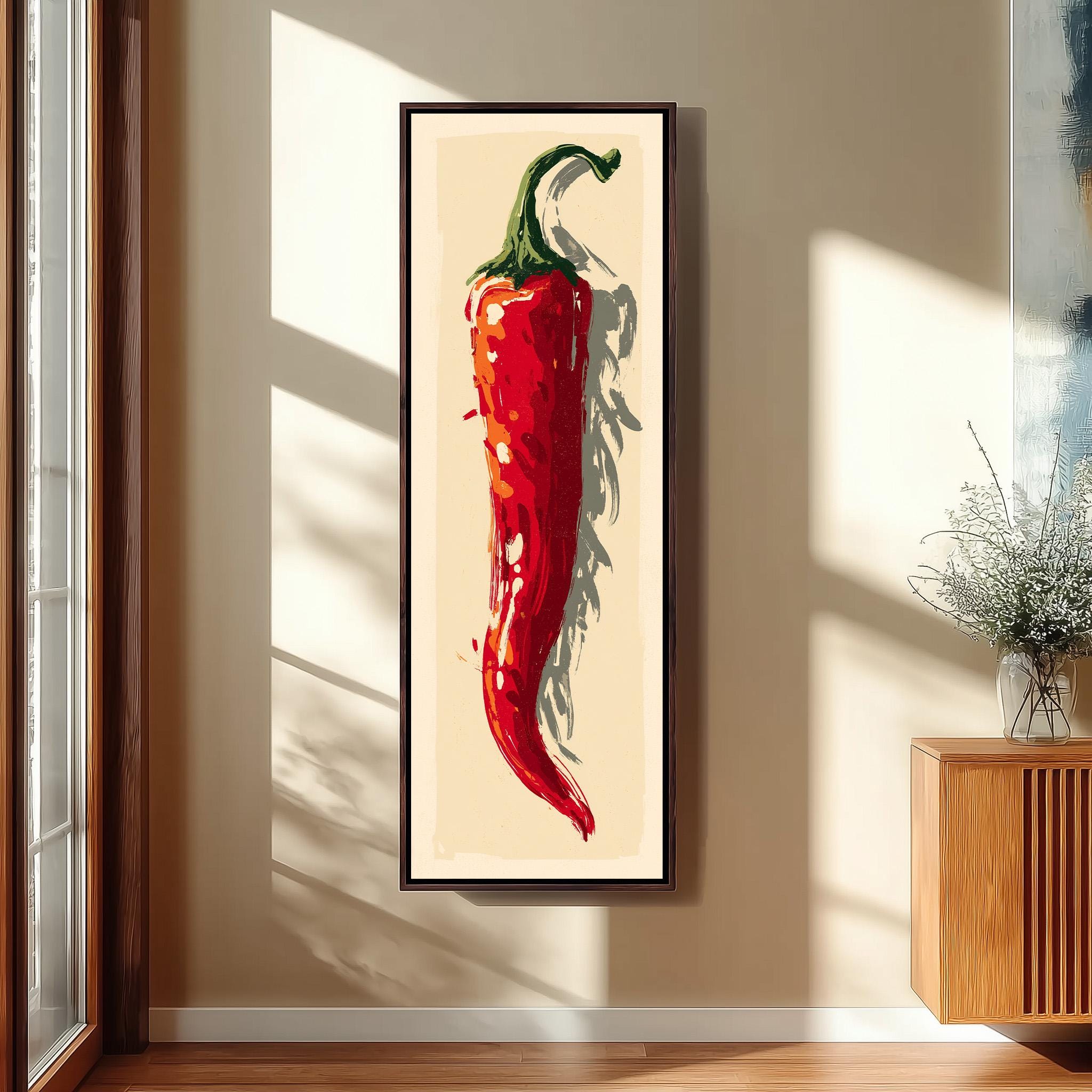 a large framed painting of a red chili pepper hanging on a wall.