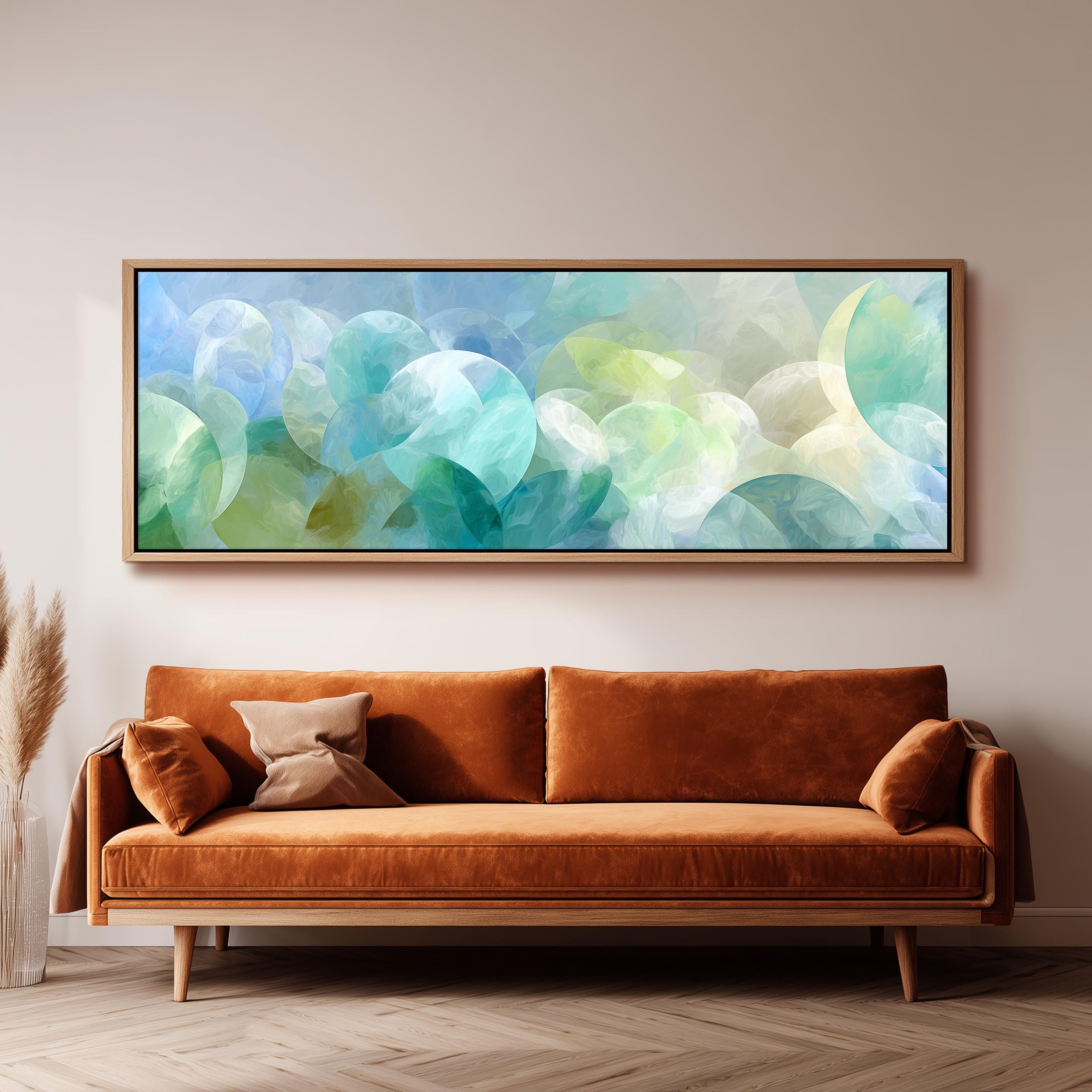a large abstract painting hanging on a wall above a brown sofa with two pillows.