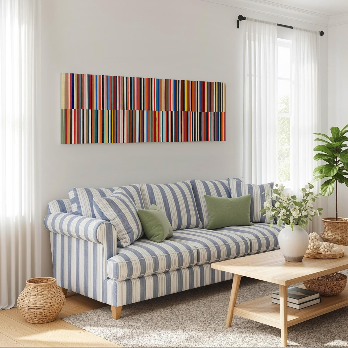 Two bands of colorful stripes long horizontal canvas print above a striped sofa in a coastal living room