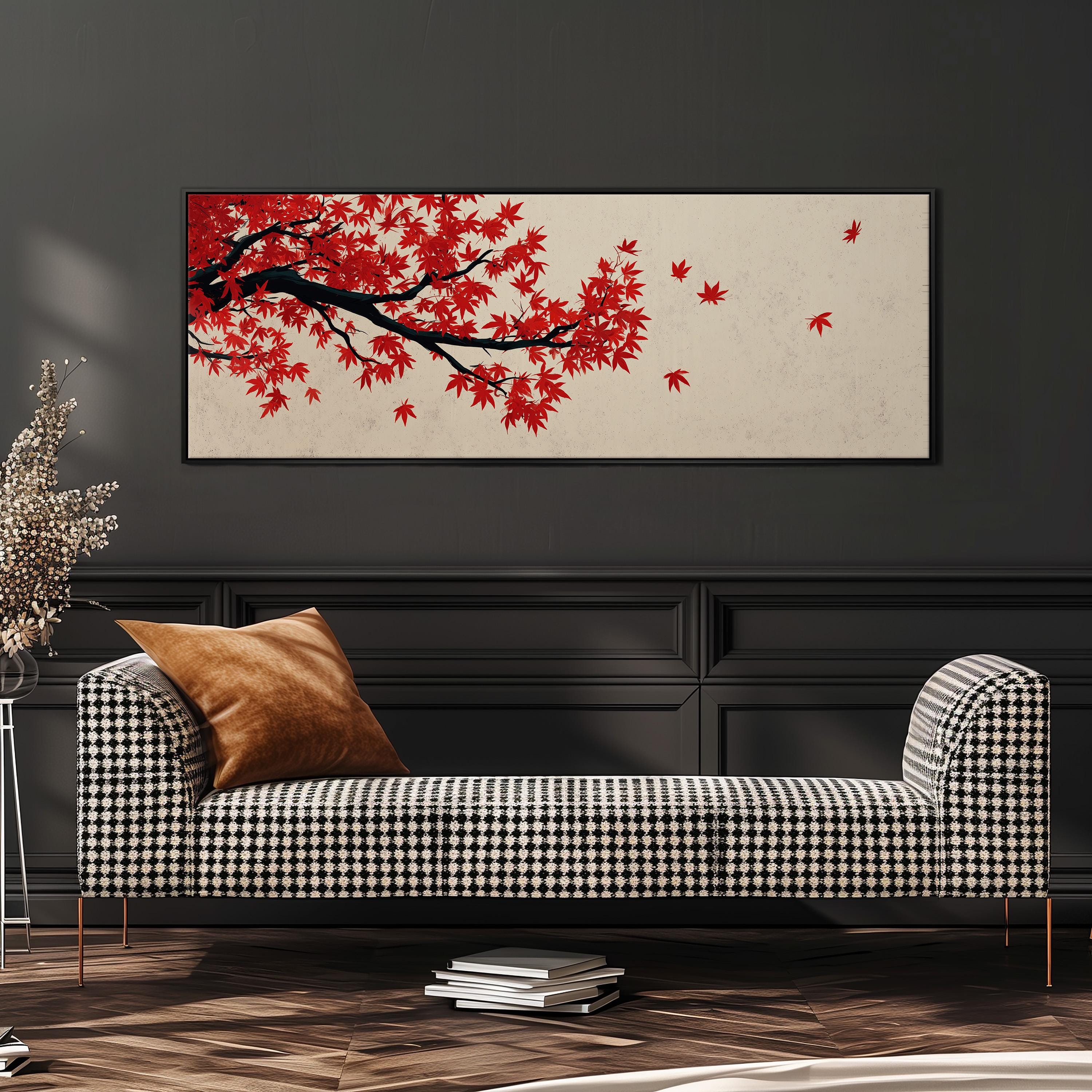 a black and white checkered sofa with a brown throw pillow, set against a dark wall with a framed artwork of a tree with red leaves hanging above it.