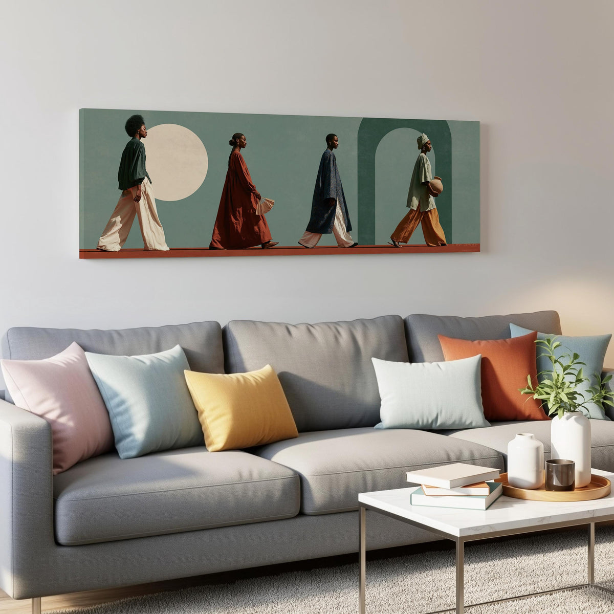 Women walking past arches and a pale moon panoramic canvas print above a grey sofa in a living room