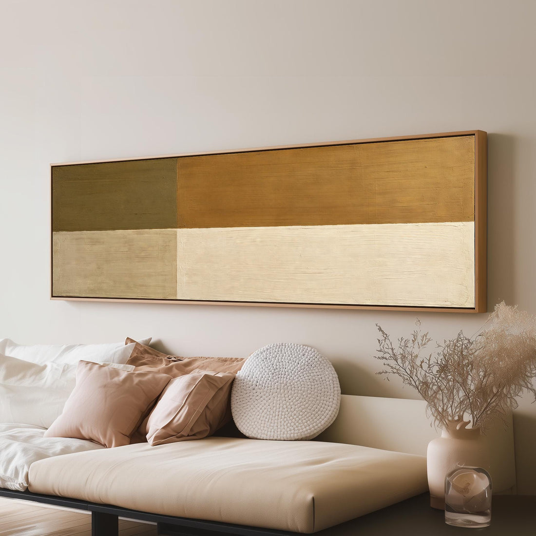 Olive and cream quadrants long horizontal canvas print above a sofa in a living room