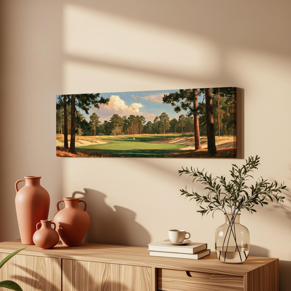 Golf fairway lined with tall pines long horizontal canvas print above a wooden sideboard