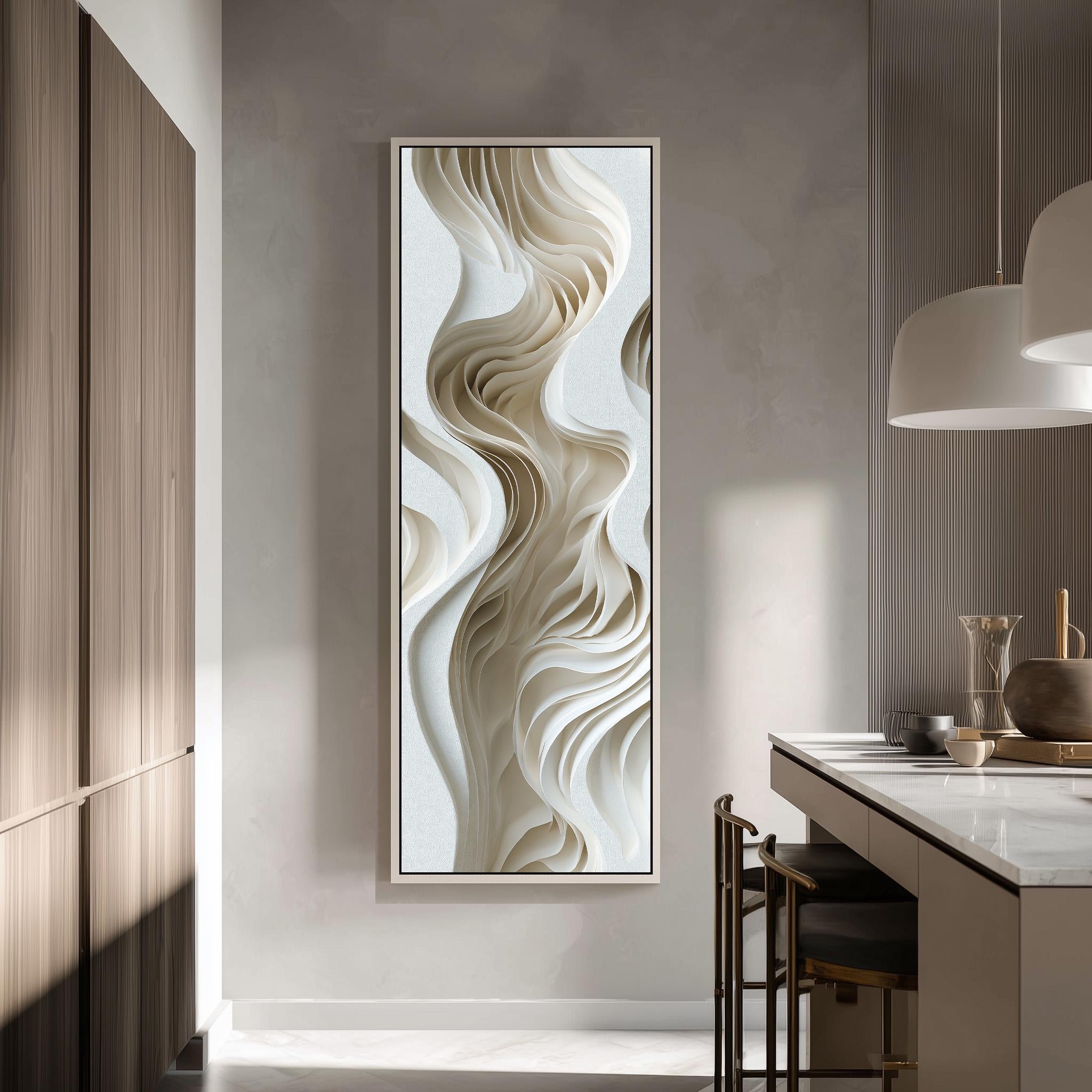 a modern kitchen with a large abstract artwork hanging on the wall. The artwork has a swirling, organic design in shades of white and beige, creating a sense of movement and fluidity. The kitchen is well-lit, with a pendant light hanging above the countertop and a wooden cabinet visible on the left side of the image.