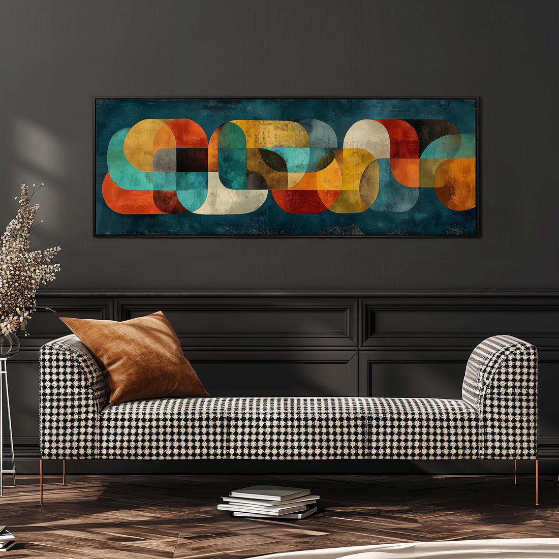 a modern living room with a black and white checkered sofa, a stack of books, and a large abstract painting hanging on the wall above the sofa.
