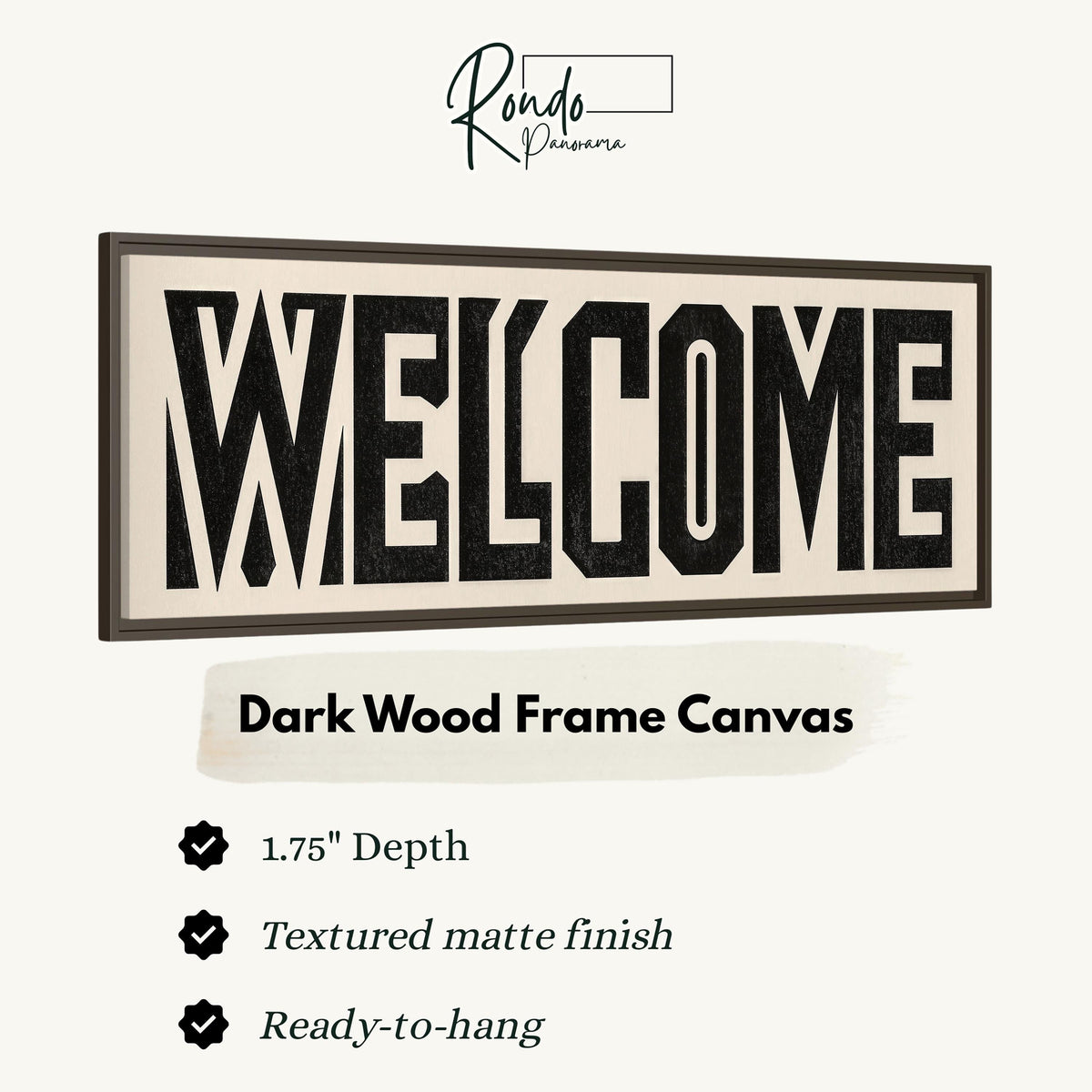 Bold welcome block letters canvas print in a dark wood floating frame