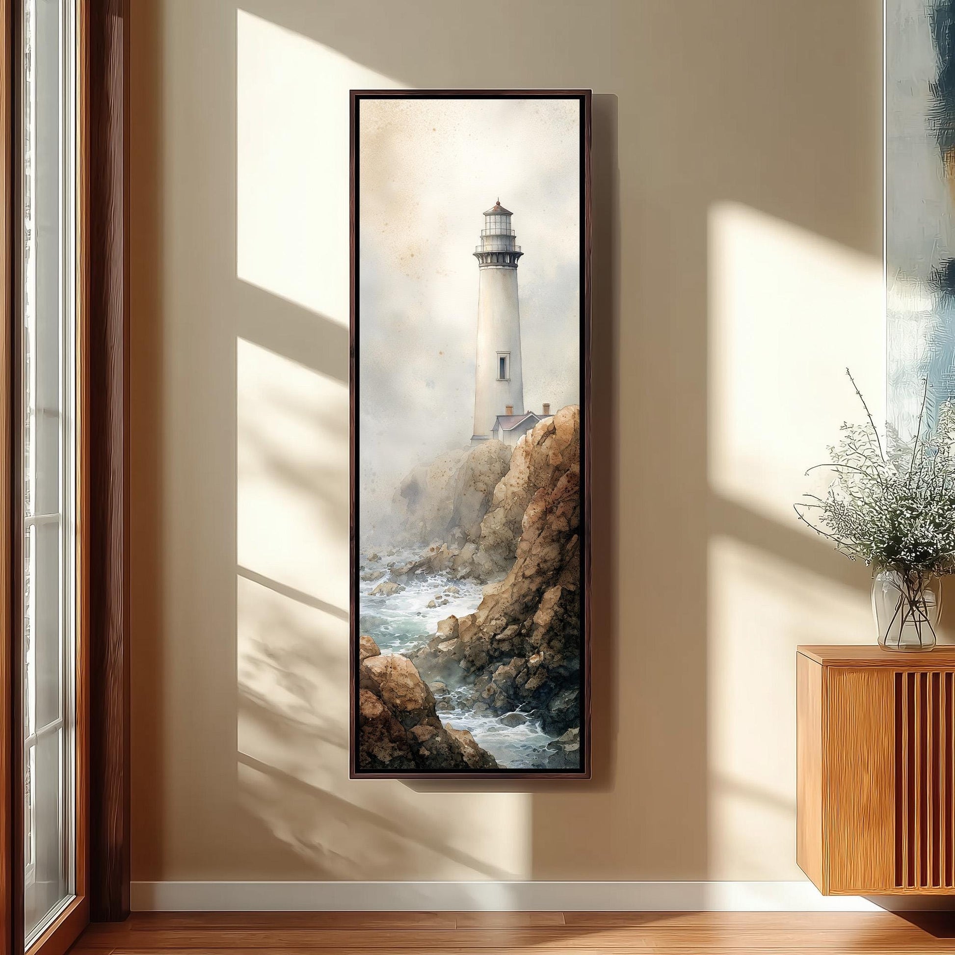 a framed painting of a lighthouse on a rocky cliff, with a serene and picturesque landscape.