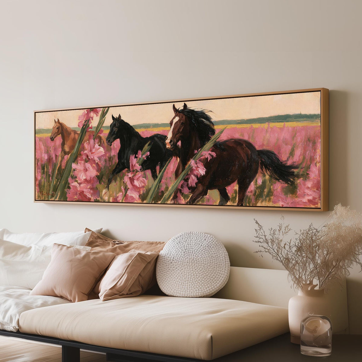 Horses running through pink gladiolus panoramic canvas print above a sofa in a living room