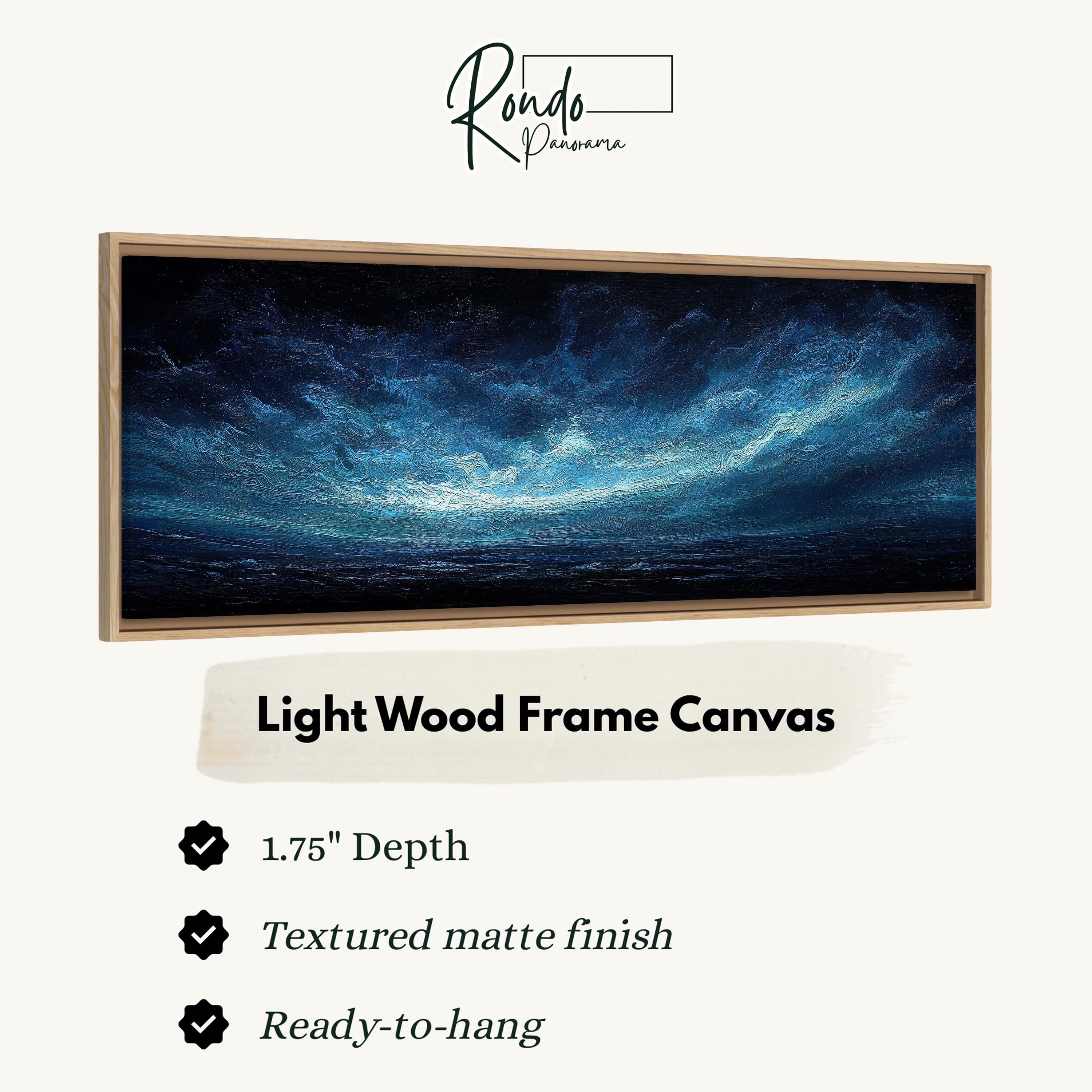 The image is a framed artwork depicting a serene night sky with a dark blue hue and a light blue horizon. The frame is described as a light wood frame canvas, which is 1.75" deep and has a textured matte finish. It is ready to hang.