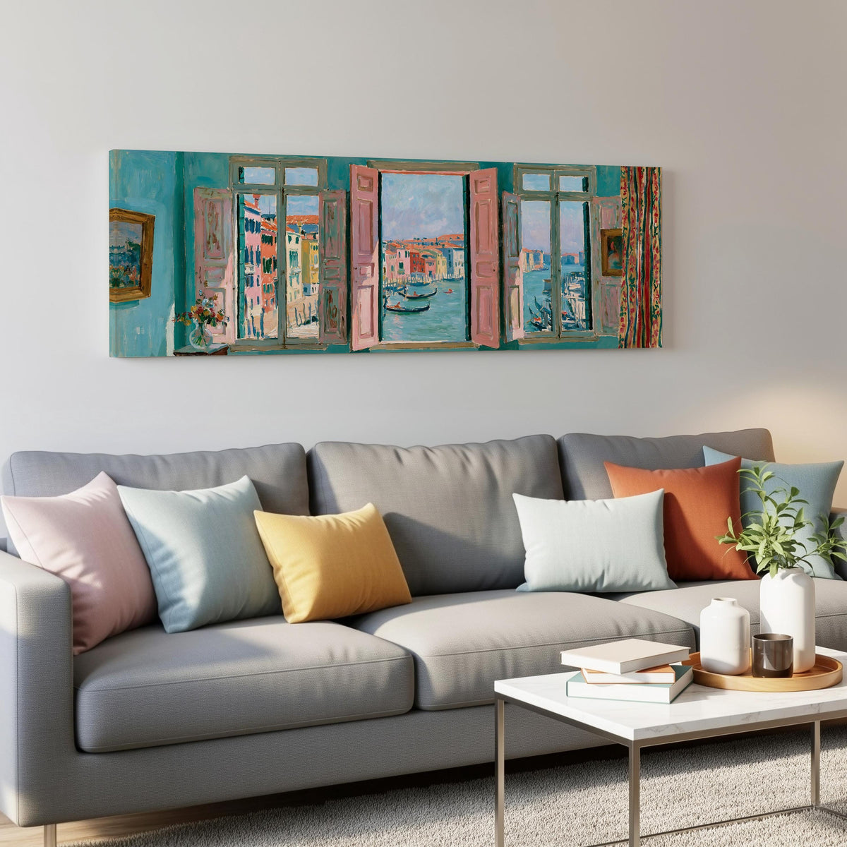 Venice canal and gondolas through a window panoramic canvas print above a grey sofa in a living room