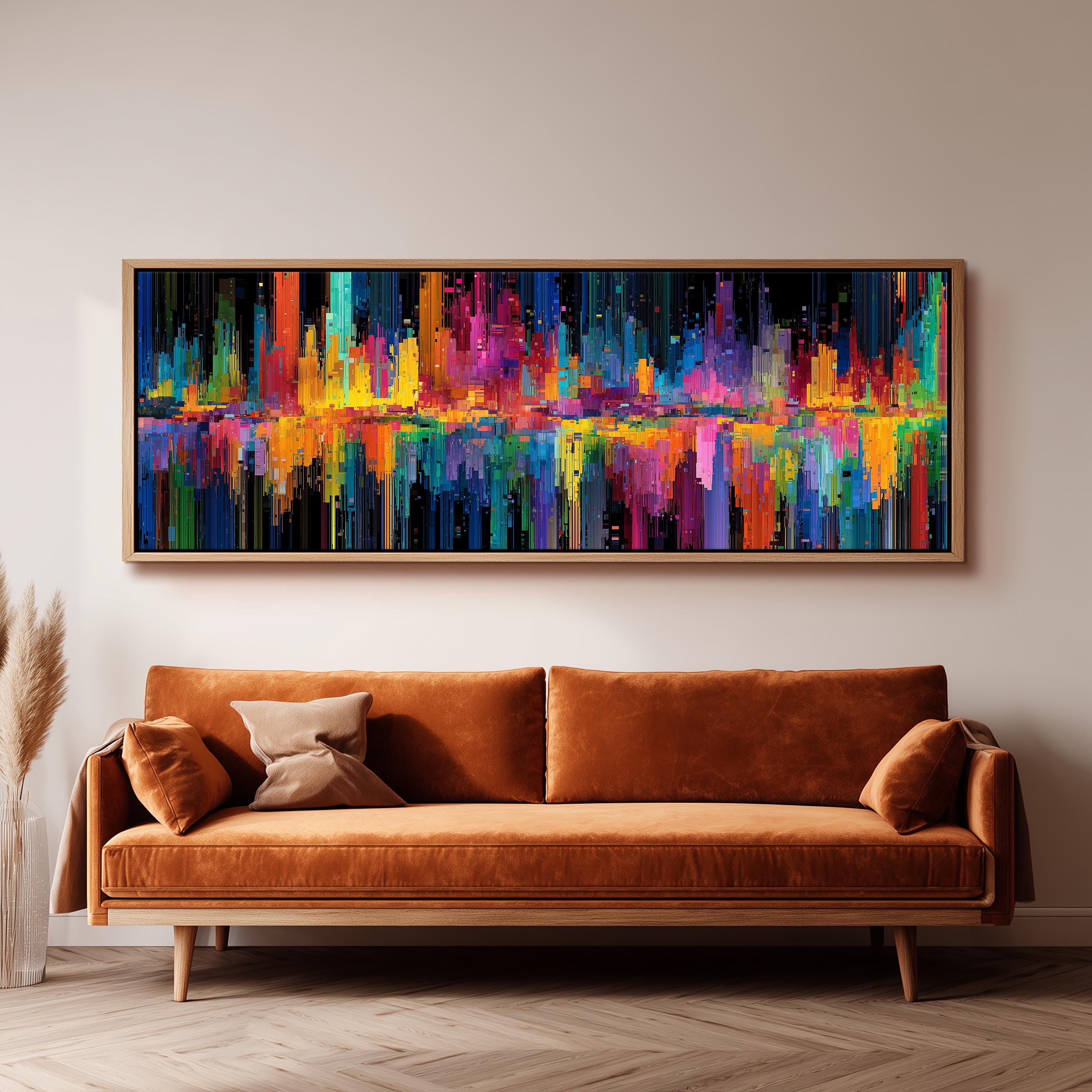 a large, colorful abstract painting hanging on a wall above a brown sofa.