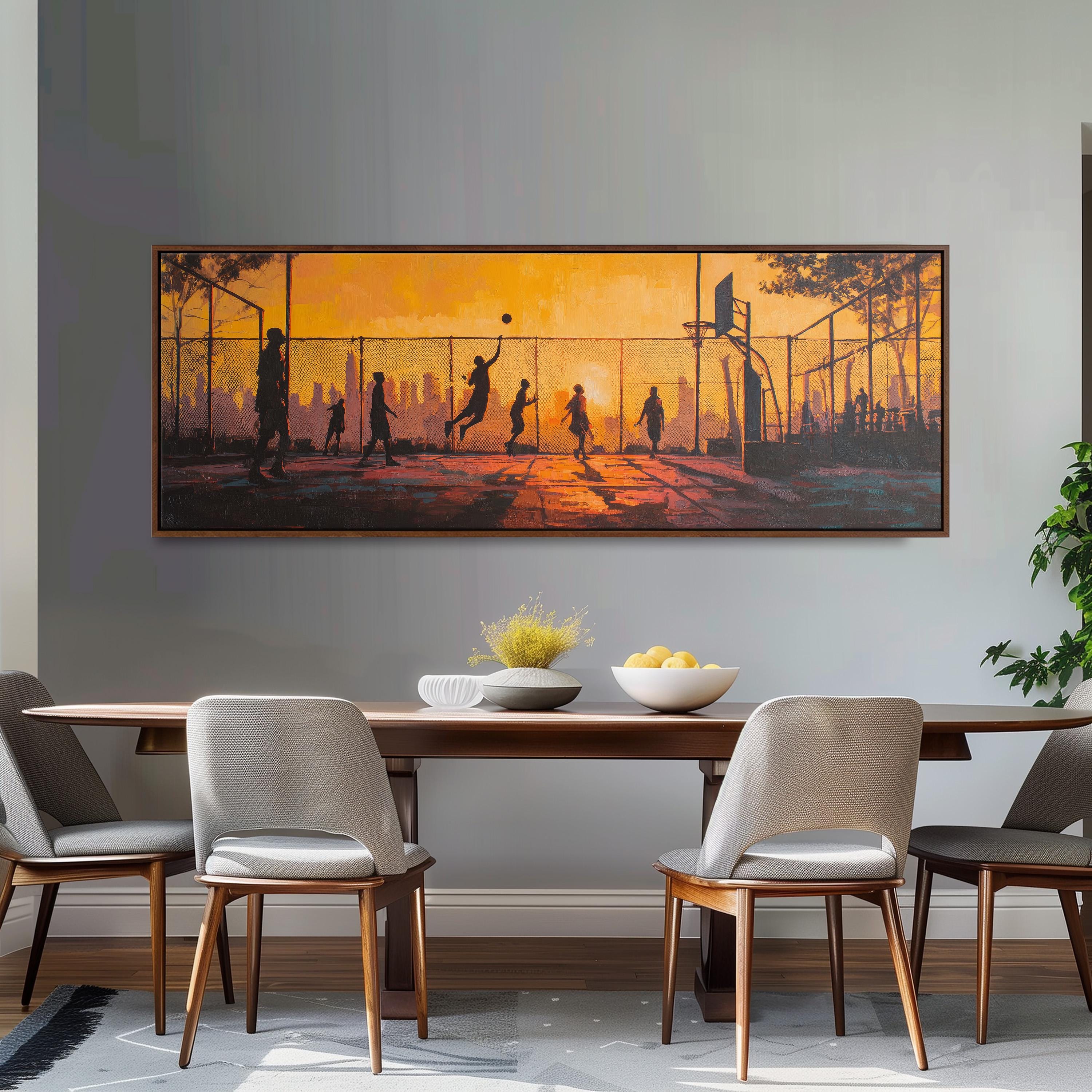 a dining room with a large painting of people playing basketball on the wall above a wooden dining table with four chairs.
