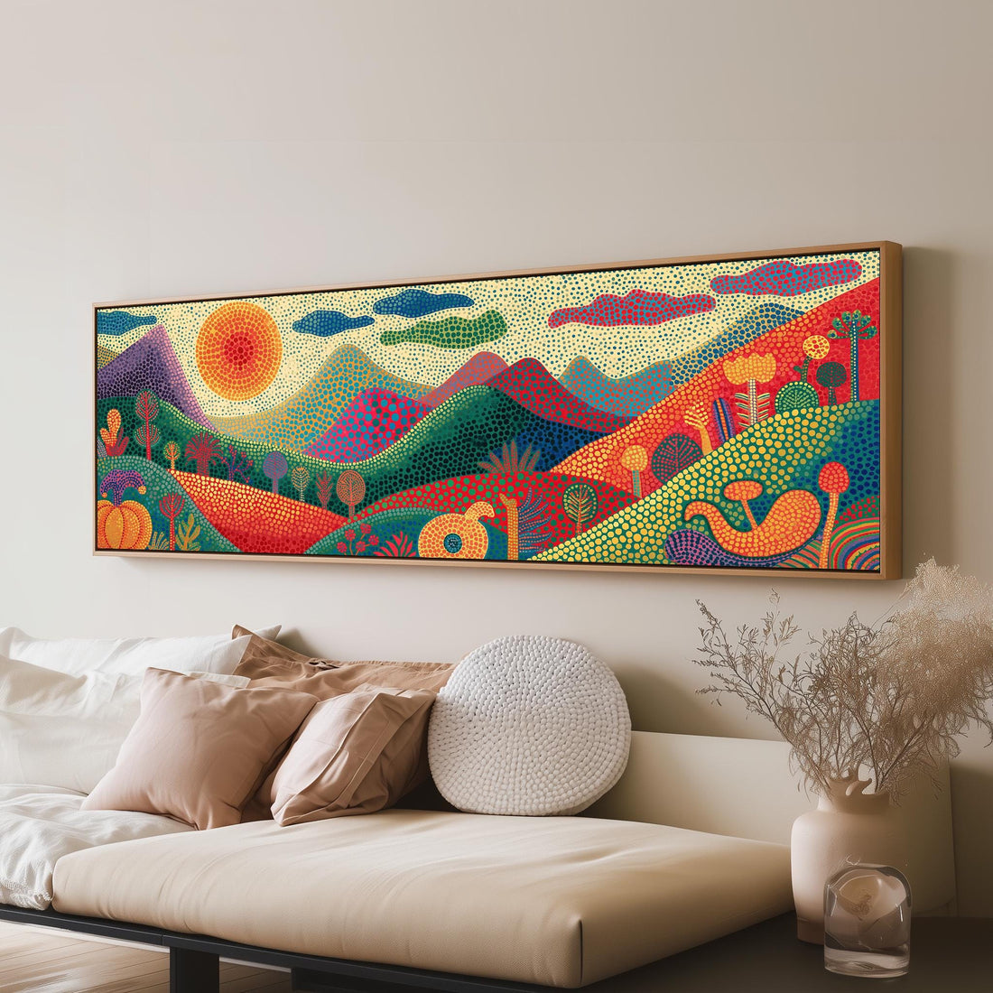 Dotted mountains under a sunburst long horizontal canvas print above a sofa in a living room