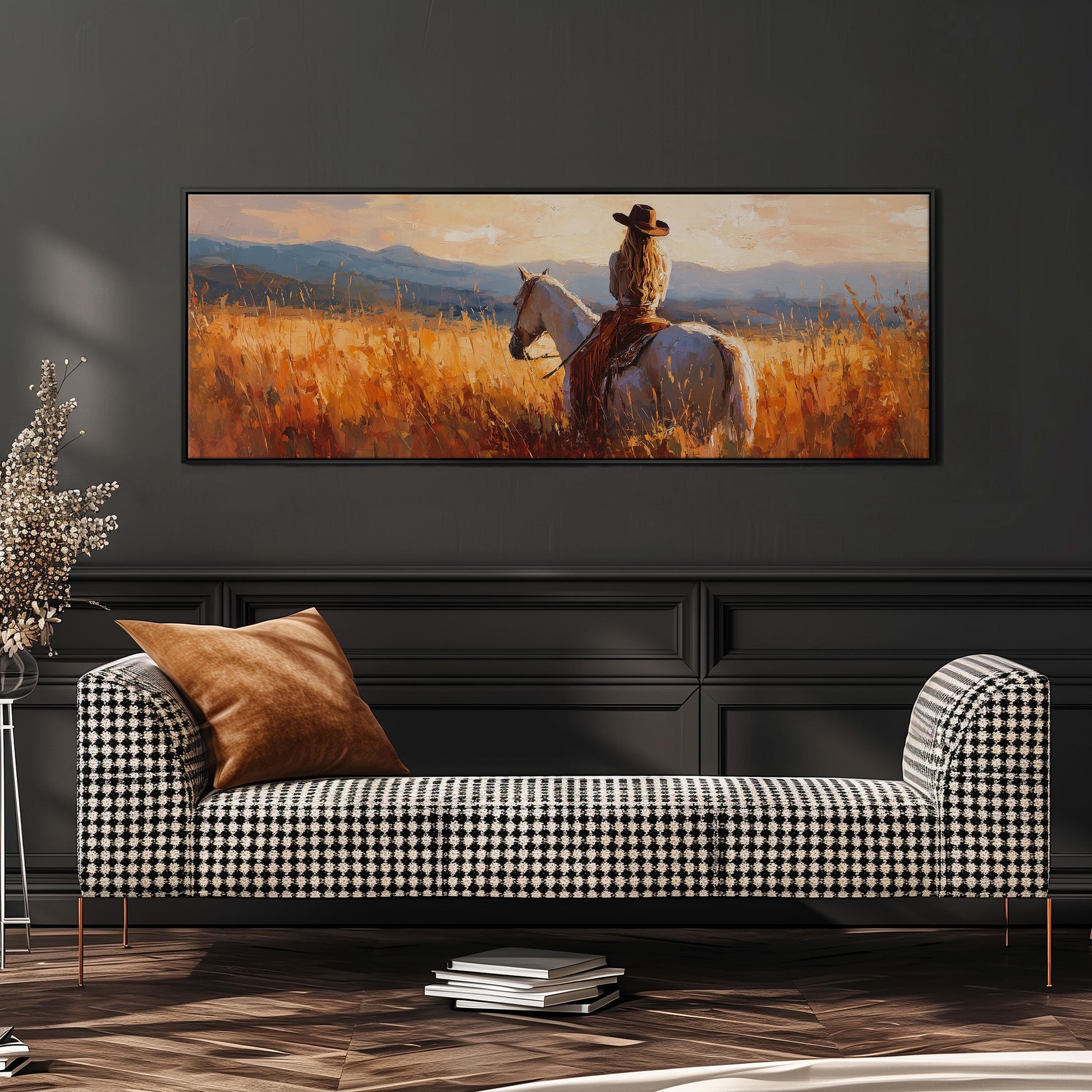 a woman riding a horse in a field, with a large painting of the scene hanging on the wall above a black and white checkered sofa.