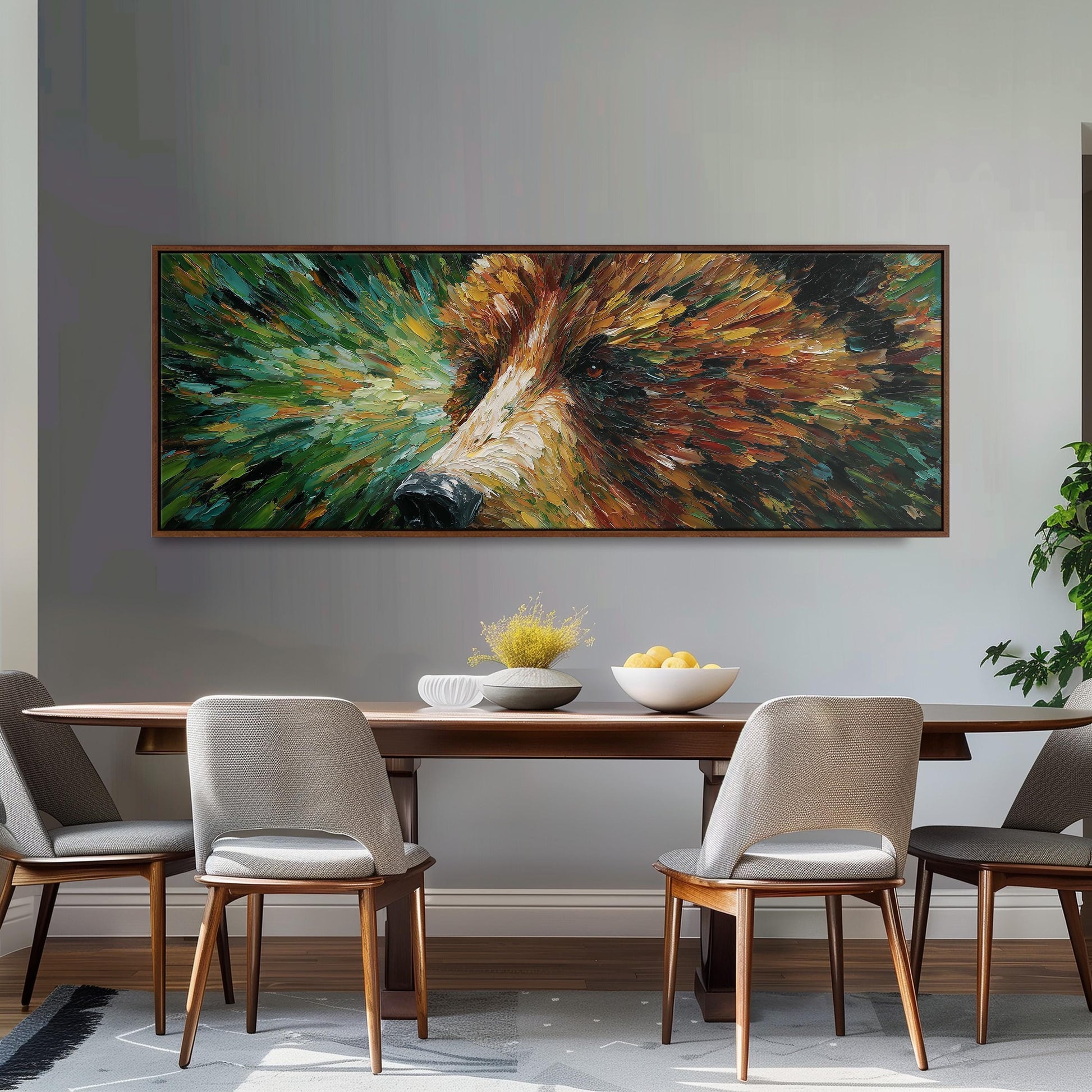 a large, colorful painting of a bear's face hanging on a wall above a wooden dining table with four chairs. The table is set with a bowl of fruit and a vase of flowers, creating a cozy and inviting atmosphere.