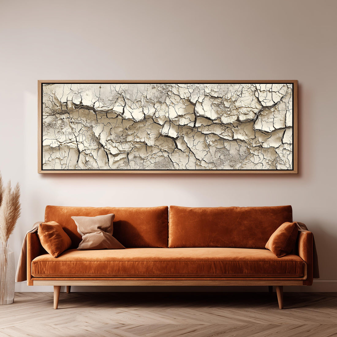 a bedroom with a bed covered in white sheets and pillows, and a large, textured, cracked wall art piece above the bed.