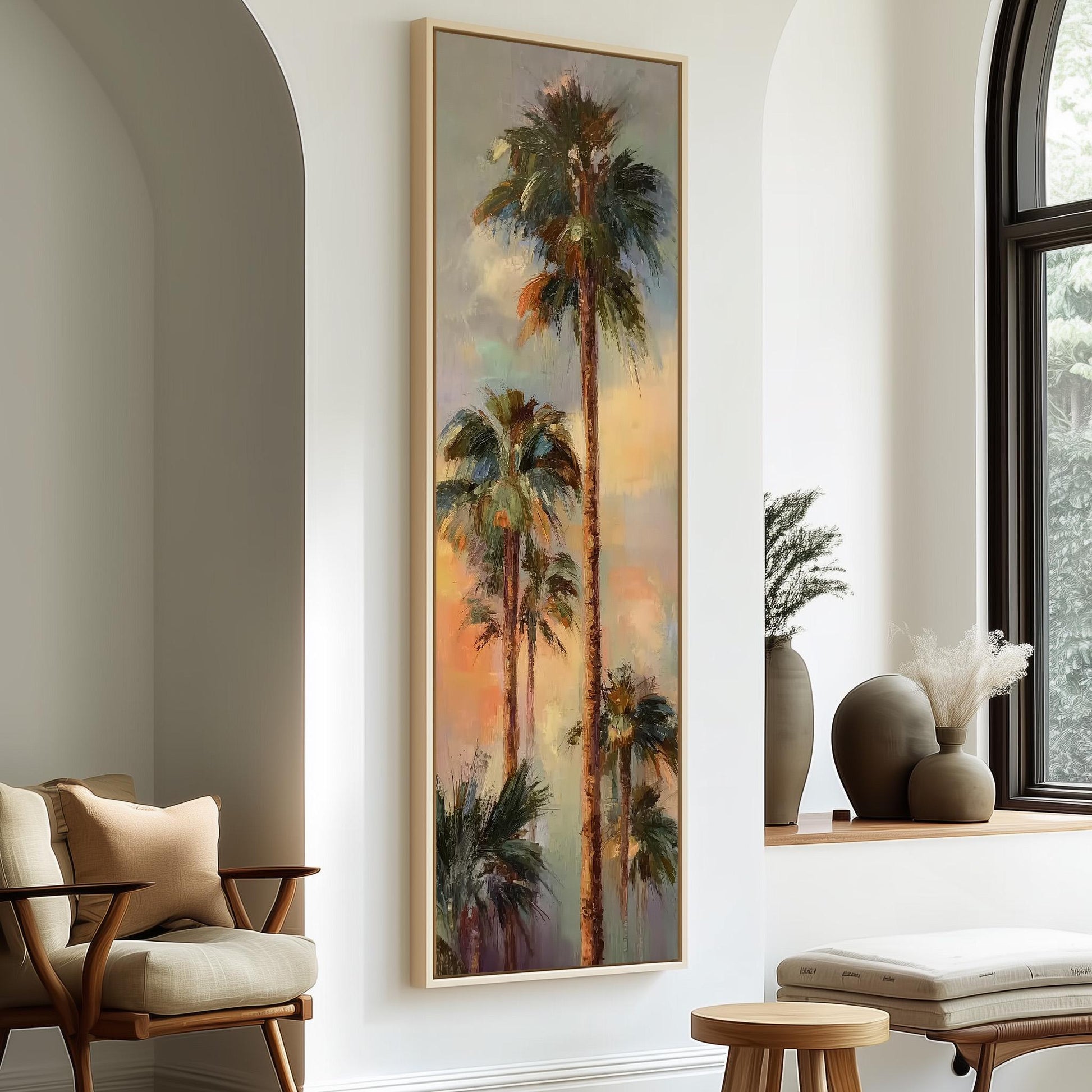 a large painting of palm trees hanging on a wall in a room with a wooden chair and a small table.
