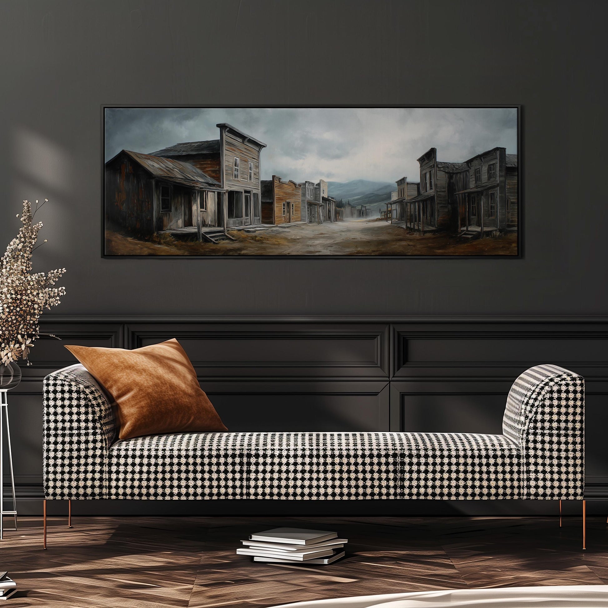 a large painting of a town scene hanging on a wall above a black and white checkered sofa with a brown throw pillow.