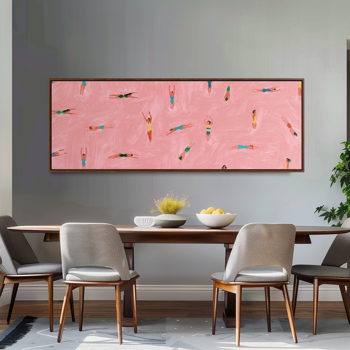 Tiny swimmers in a pink pool from above long horizontal canvas print above a dining table