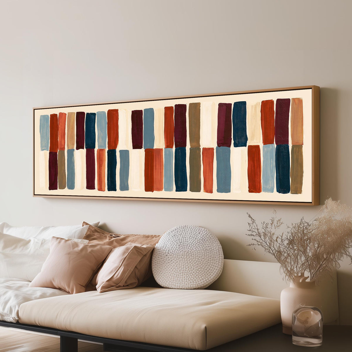Two tiers of staggered stripe blocks panoramic canvas print above a sofa in a living room